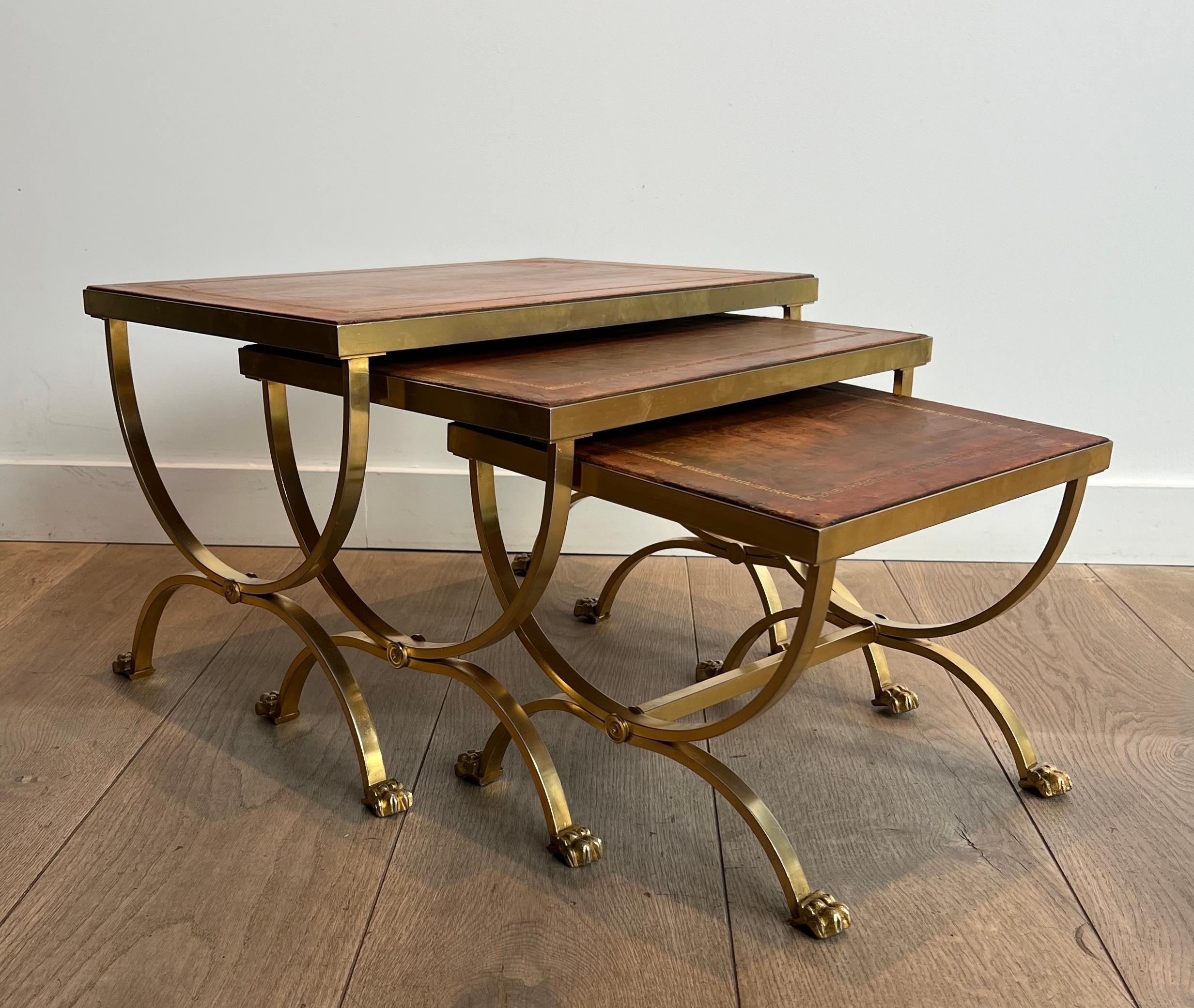 Neoclassical Set of Gilt Metal Nesting Tables with Claw Feet & Leather Tops by Maison Jansen For Sale