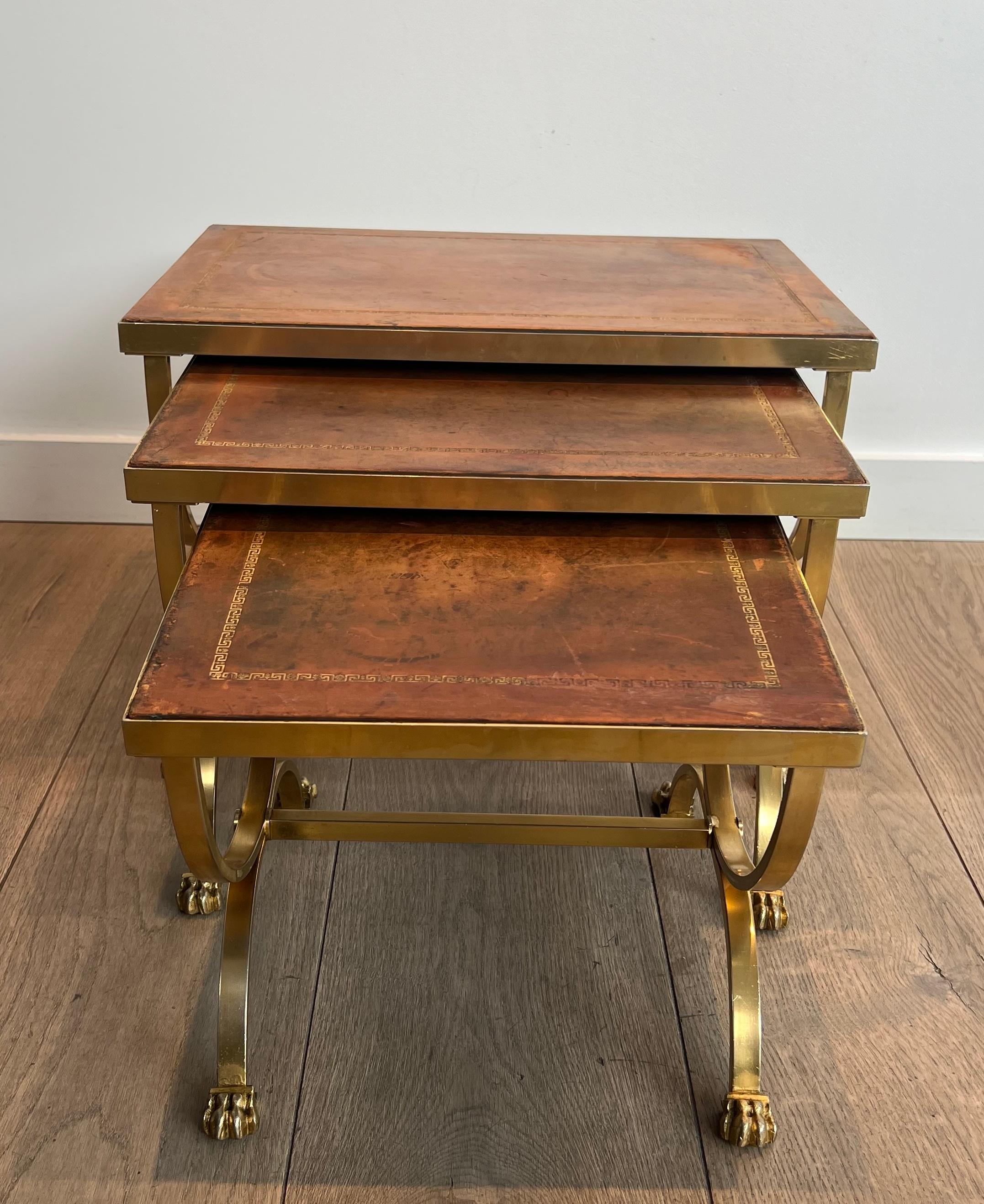 French Set of Gilt Metal Nesting Tables with Claw Feet & Leather Tops by Maison Jansen For Sale