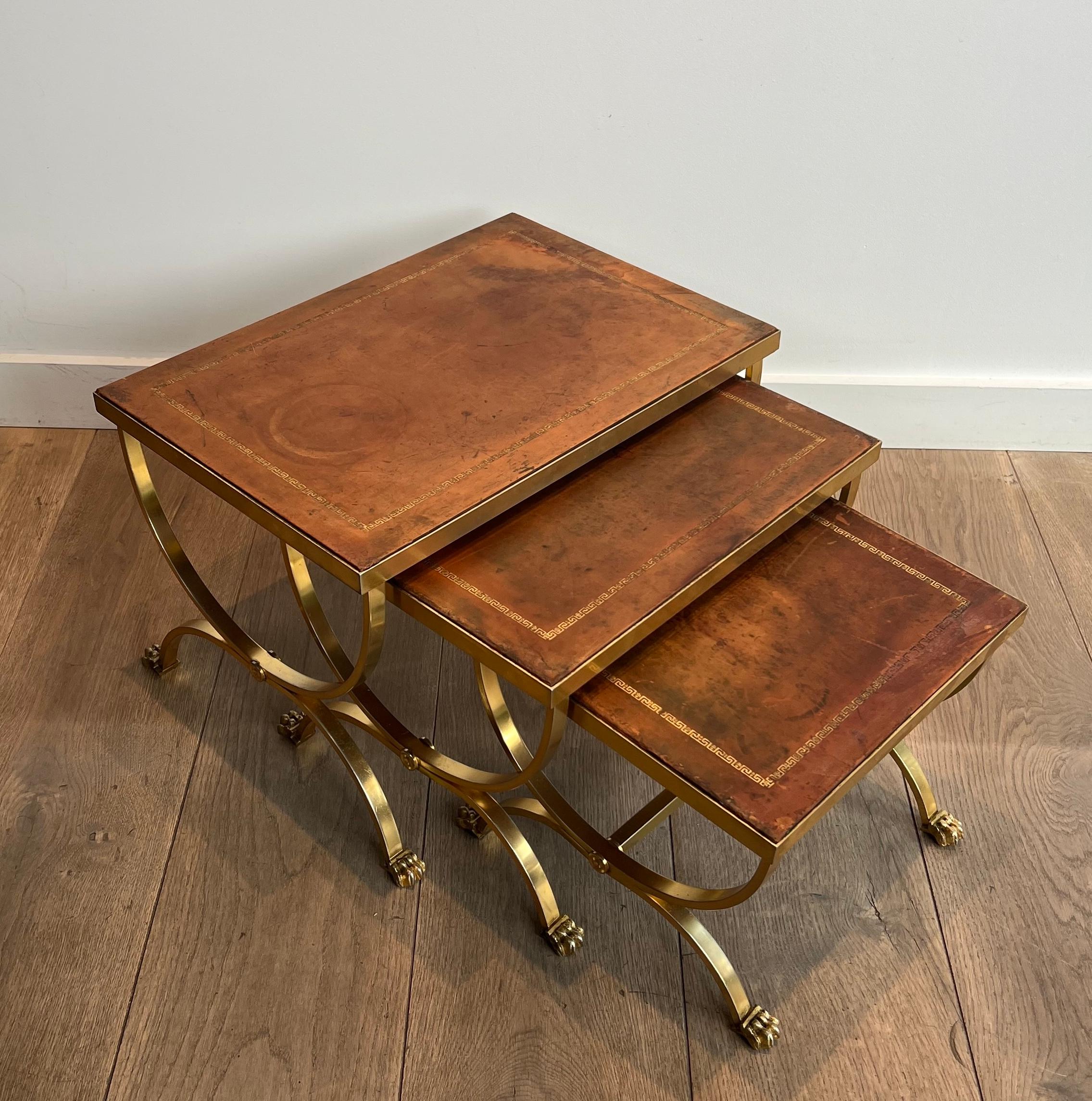 Mid-20th Century Set of Gilt Metal Nesting Tables with Claw Feet & Leather Tops by Maison Jansen For Sale