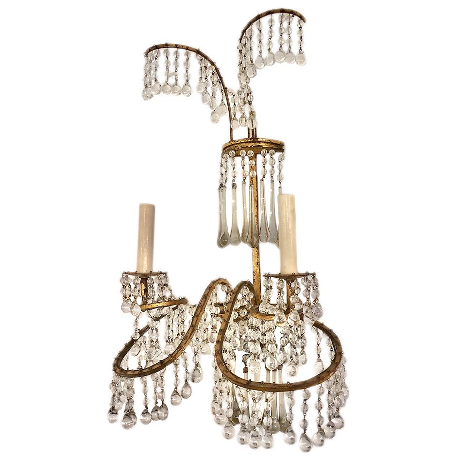 Set of four circa 1920's French gilt metal and crystal drop sconces with original patina. Sold per pair.

Measurements:
Height: 24