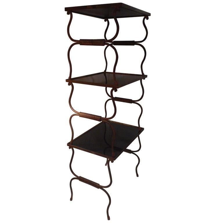 Set of gilt wrought iron nesting tables from the 1940s. 
Black opaline tops.