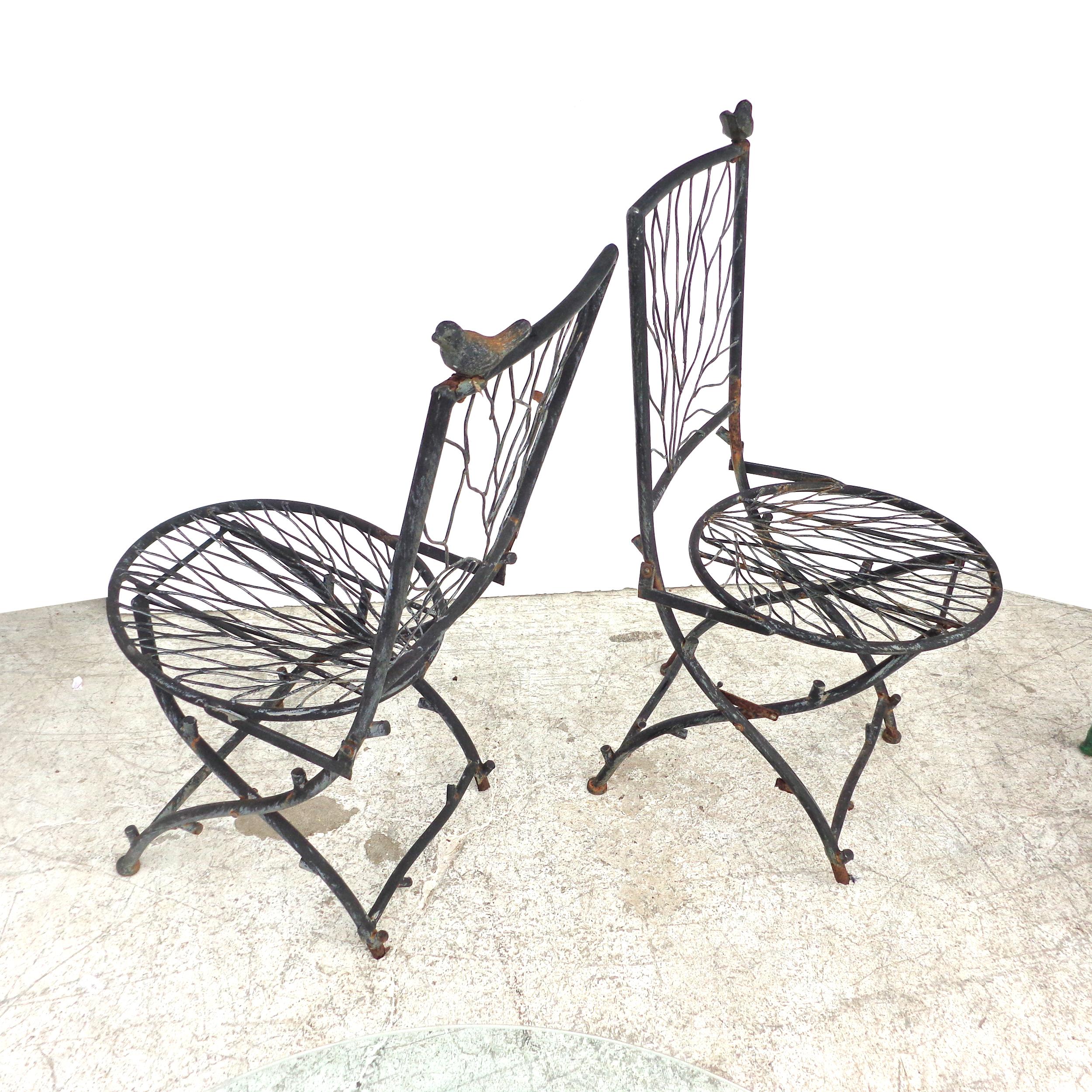 Set of Outdoor Giocametti Style table and chairs

In the manner of Diego Giacometti, this charming patio table and chairs would fit in any indoor or outdoor setting. The chairs fold for easy l
storage and the table is topped with glass.




