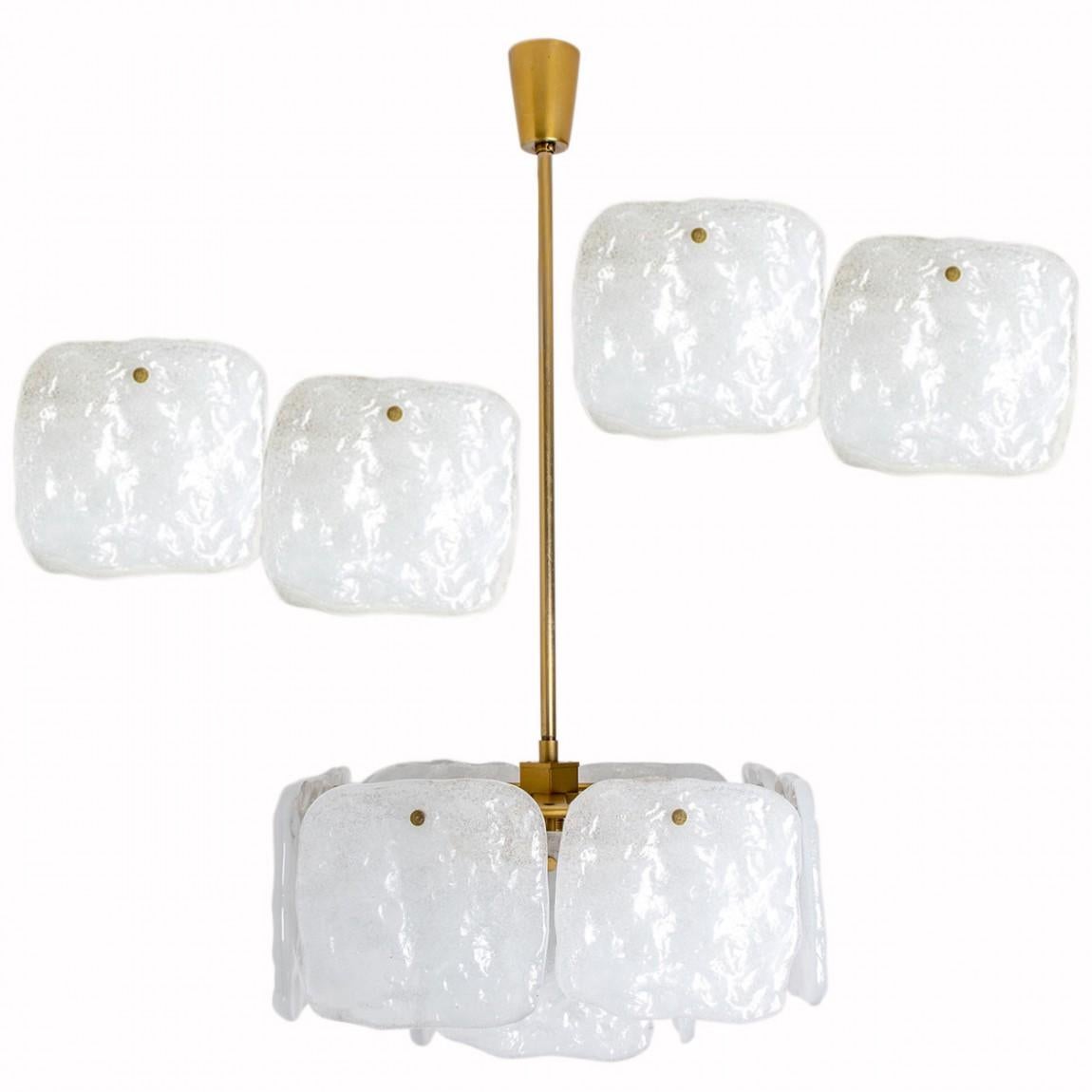 A stunning set of light fixtures designed by J.T Kalmar, manufactured by Kalmar Franken, Austria in the 1960s.
High-end and handmade design from the 20th century. The large squares of white, opaque textured glass shades provides a nicely diffuse