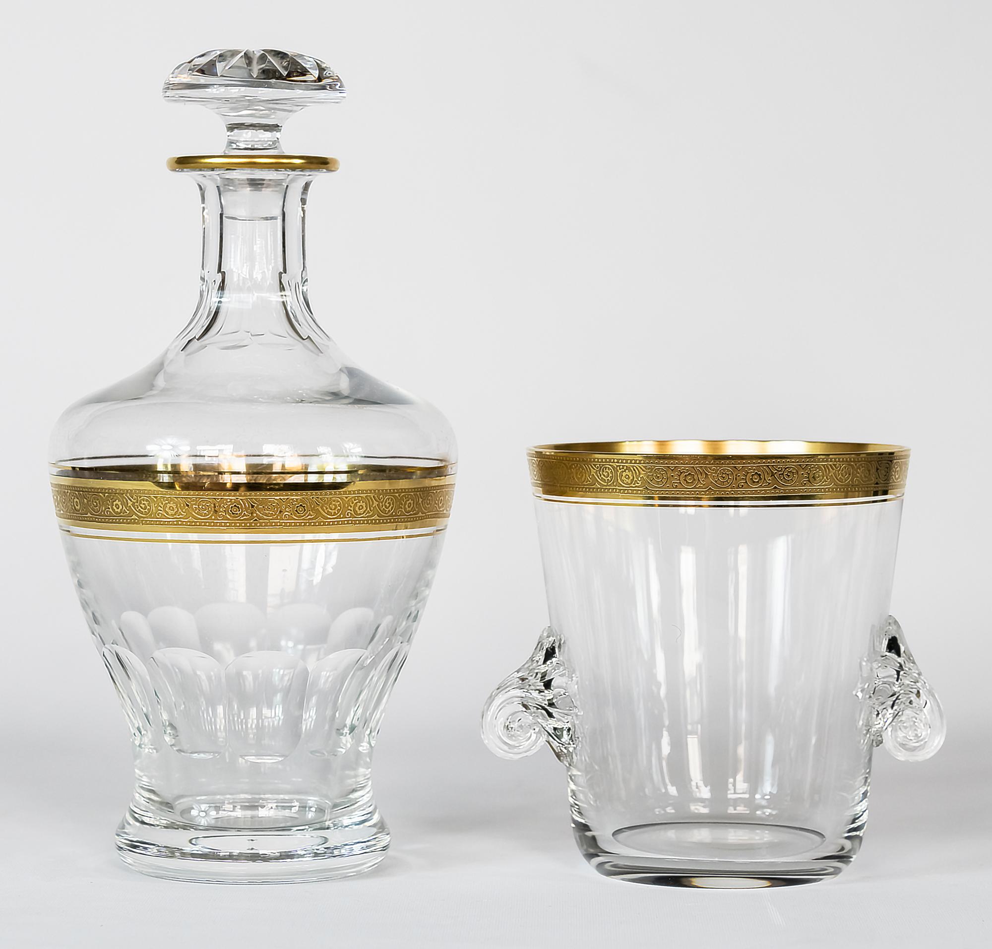 The set of glass caraffe/decanter and ice bucket with the rich textured gold rim from Concord Collection by Theresiethal.
Very good condition.

 