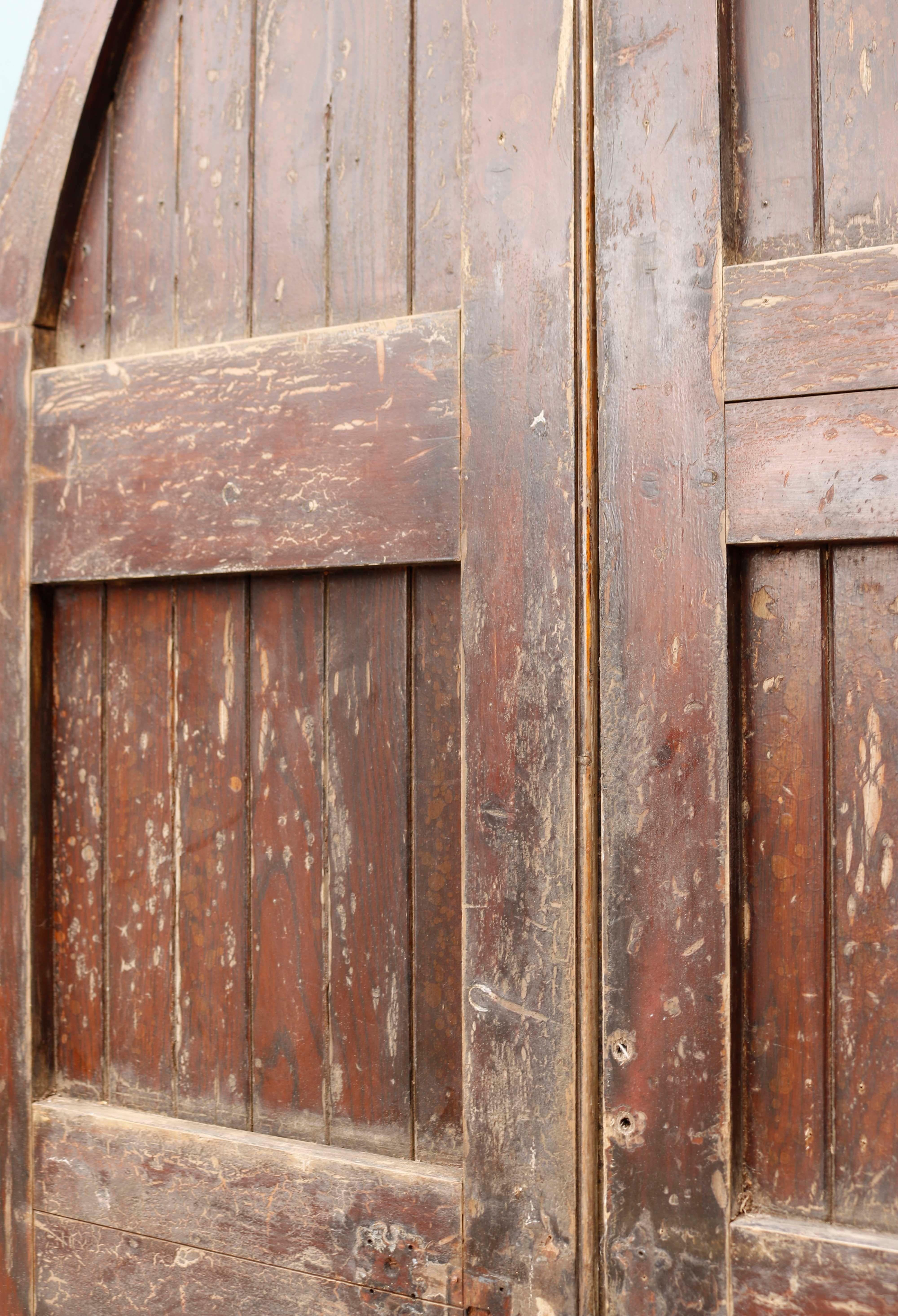 Set of Wooden Gothic Style Church doors. A pair of reclaimed doors in the gothic revival style. Fitted with decorative cast iron hinges. The doors are constructed from pine and faced with oak. The original frame is included.

Addition