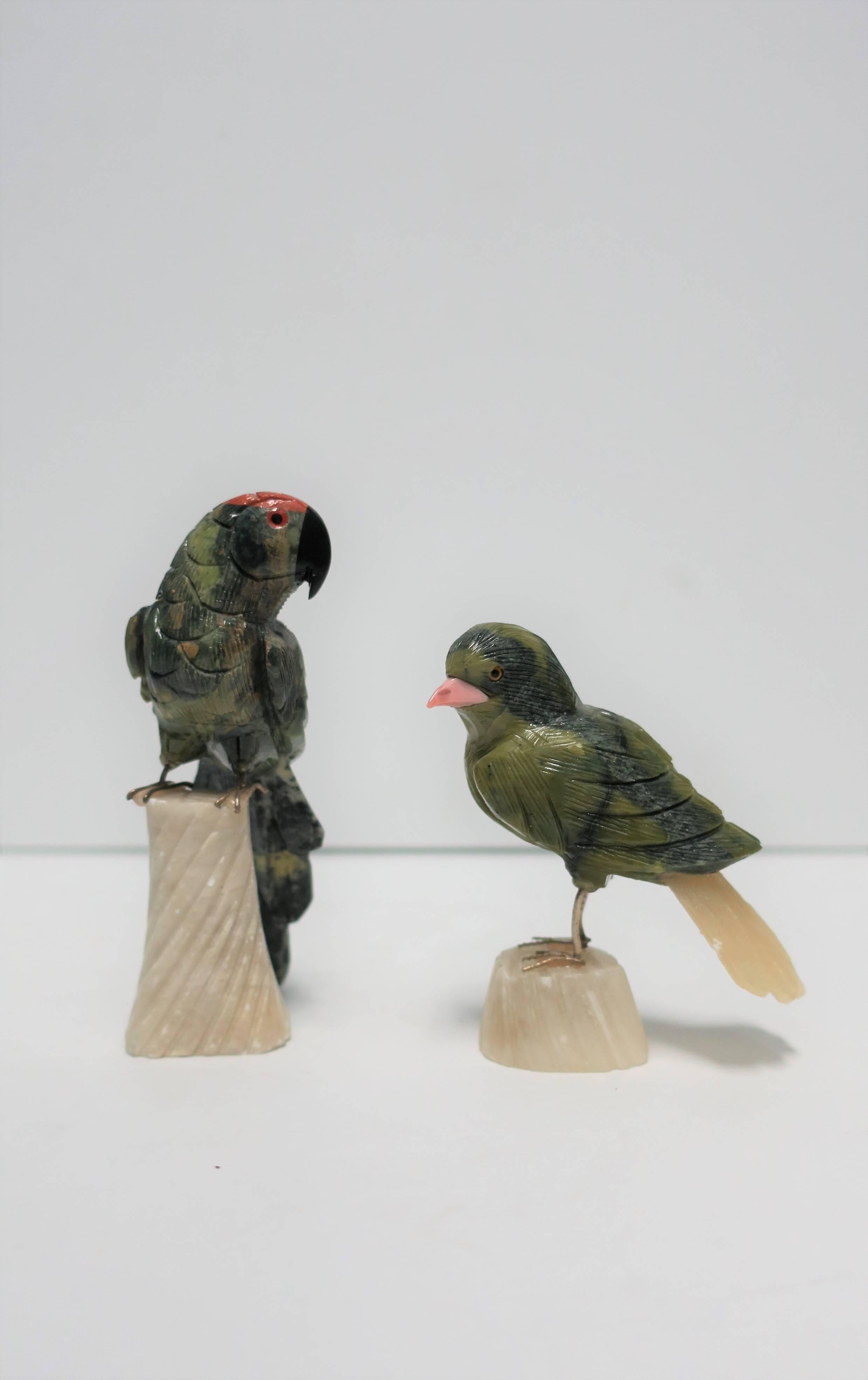 A beautiful vintage set of green and multicolored marble, alabaster and stone bird sculptures - a parrot and a finch. Birds come with onyx plinth shown in images #4 and 5, 9-11. Set includes three pieces. Measurements include: 

Parrot: 1.75 in. W x