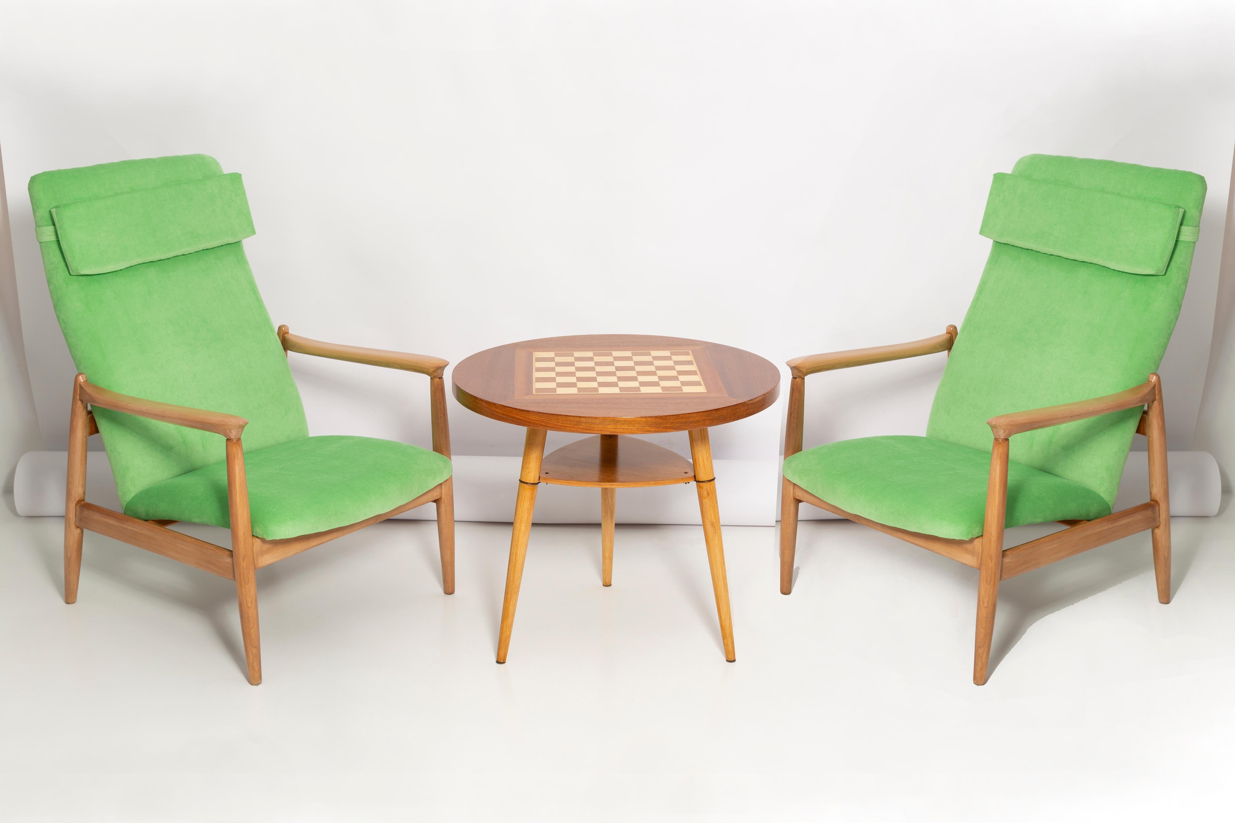 A pair of light lime green velvet armchairs, designed by Edmund Homa, a Polish architect, designer of Industrial Design and interior architecture, professor at the Academy of Fine Arts in Gdansk. The armchairs were made in the 1960s in the