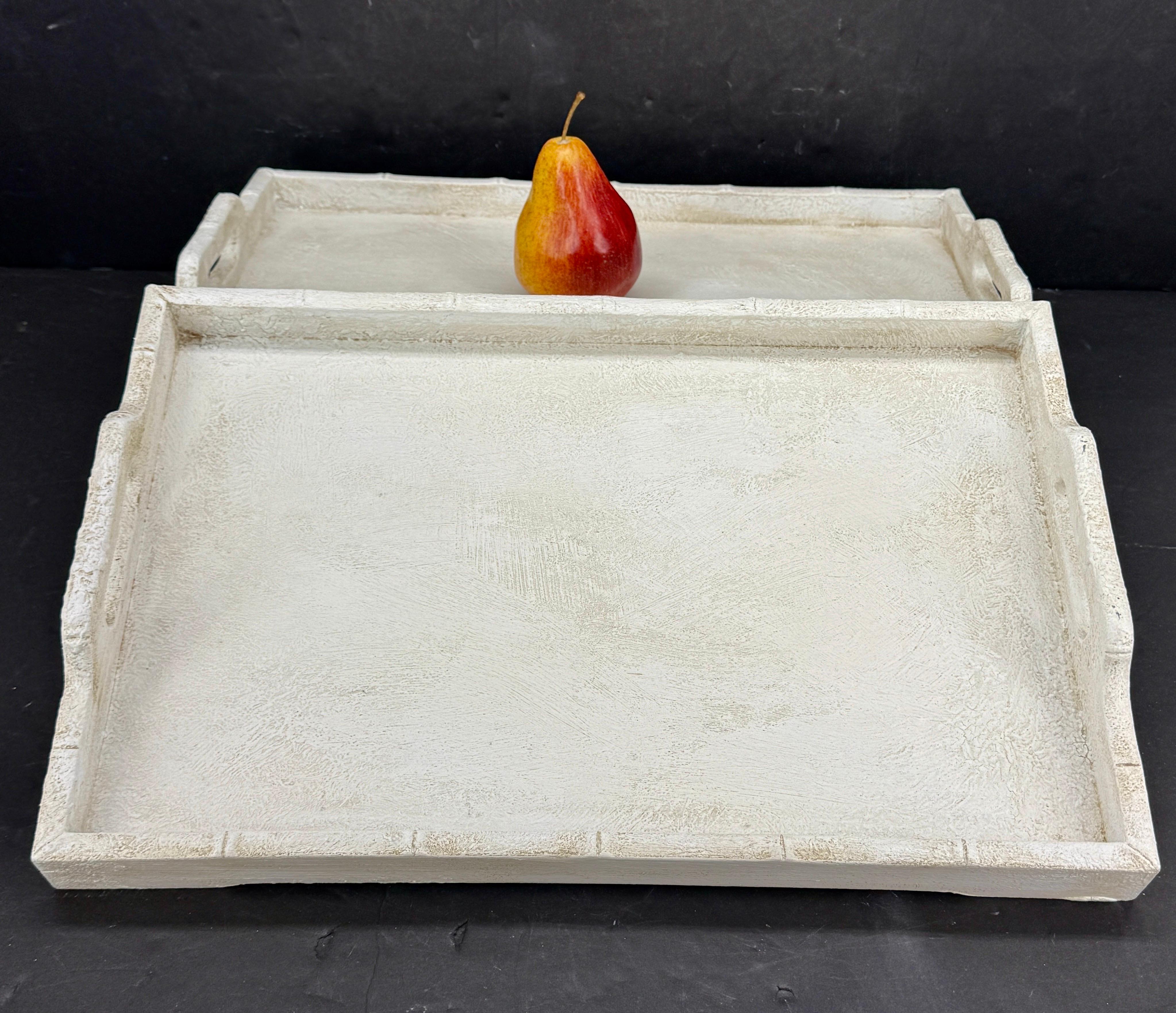 Fantastic patina on these trays painted in a soft Gustavian gray with plenty of texture. We see these trays either on an ottoman, coffee table or even vanity. Would also work well as large bar trays in any formal or informal home. 