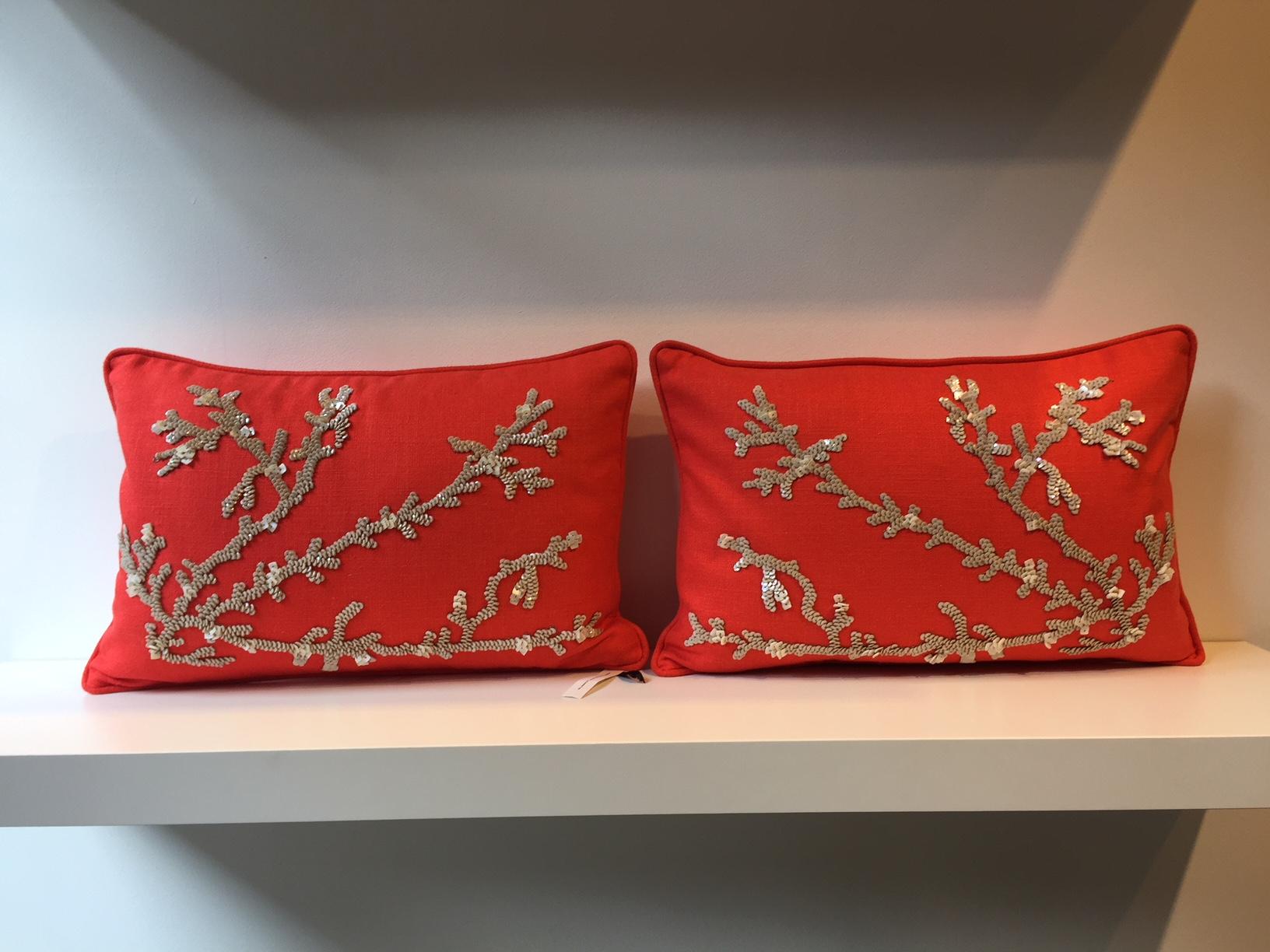 One set of cushions, 2-pieces, size 30 x 50cm,
Hand Embroidery with sequins, mother of pearl chips and silver thread on linen color coral red,
cushion cover with self piping, inside with cotton lining and concealed zipper in the bottom seam,
inner