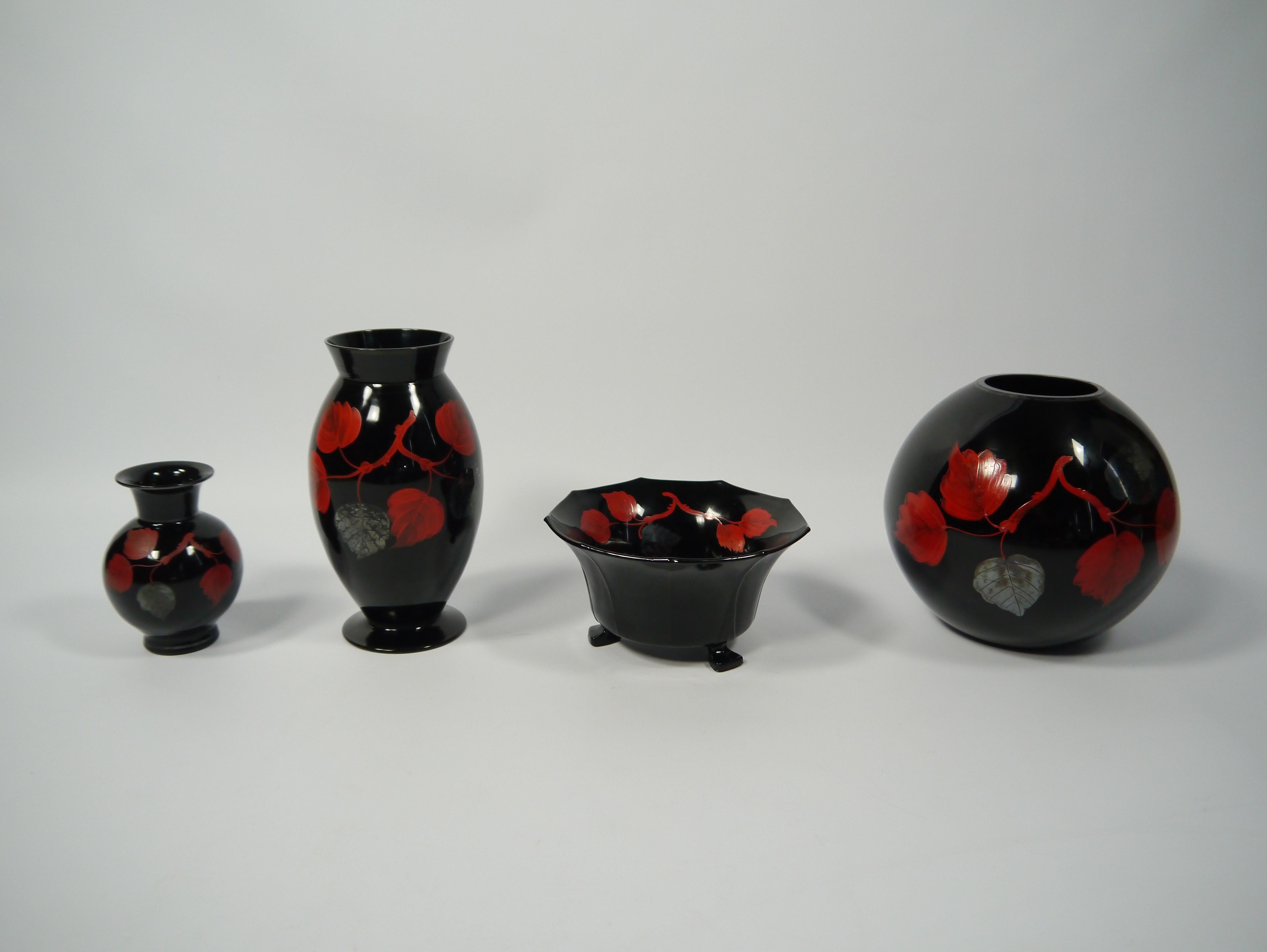 Set of four hand painted Art Deco glass vessels, delicately painted leaf & branch pattern in silver and red on jet black background,