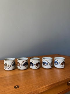 Set Of Hand Painted Pottery Tea Cups