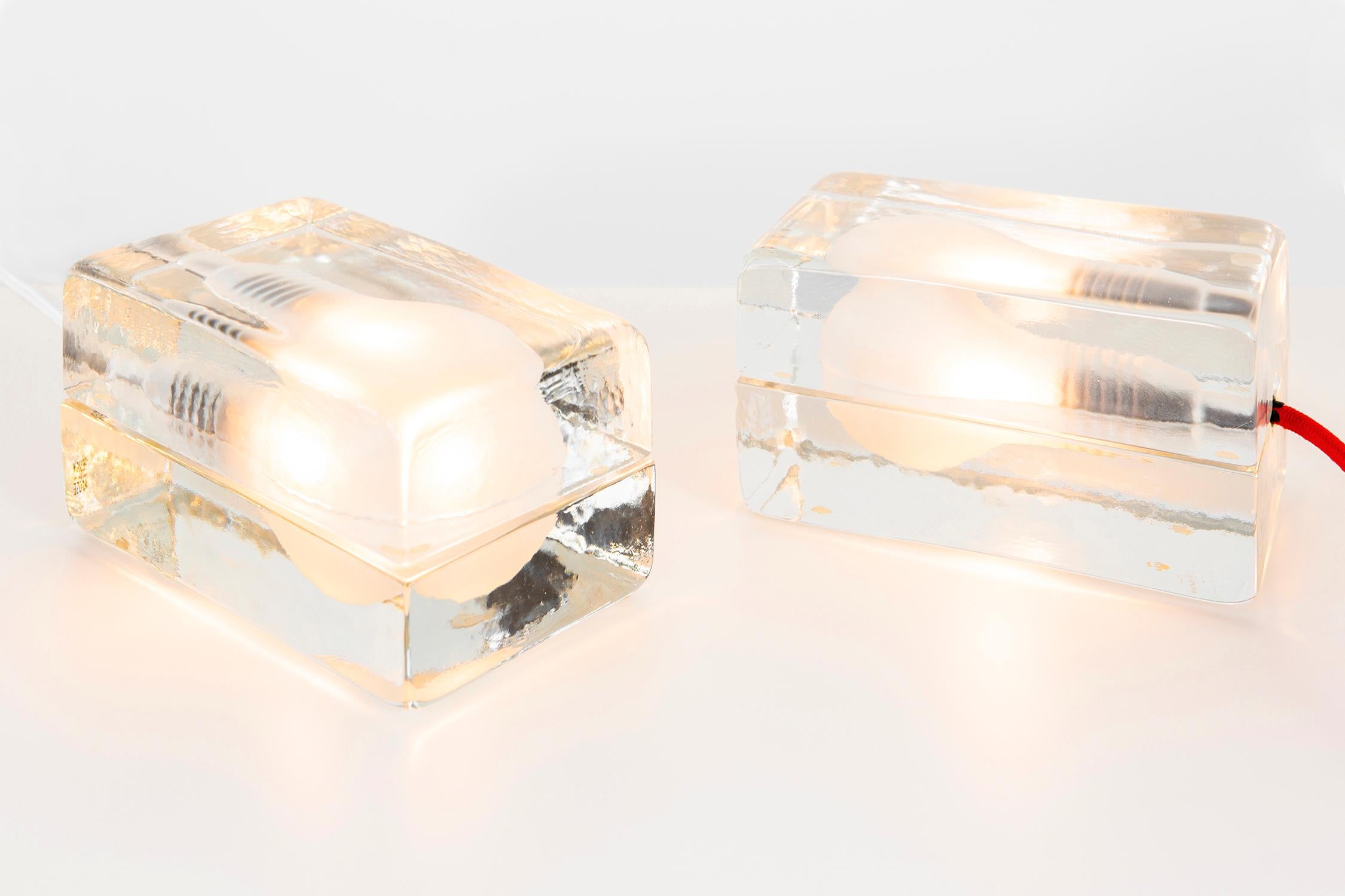 Set of two block lamps

Designed by Harri Koskinen for Design House Stockholm

Finland, circa 2000.

cast glass and fabric cord.

Measures: 3 ¾” H x 6 ½” W x 4” D.