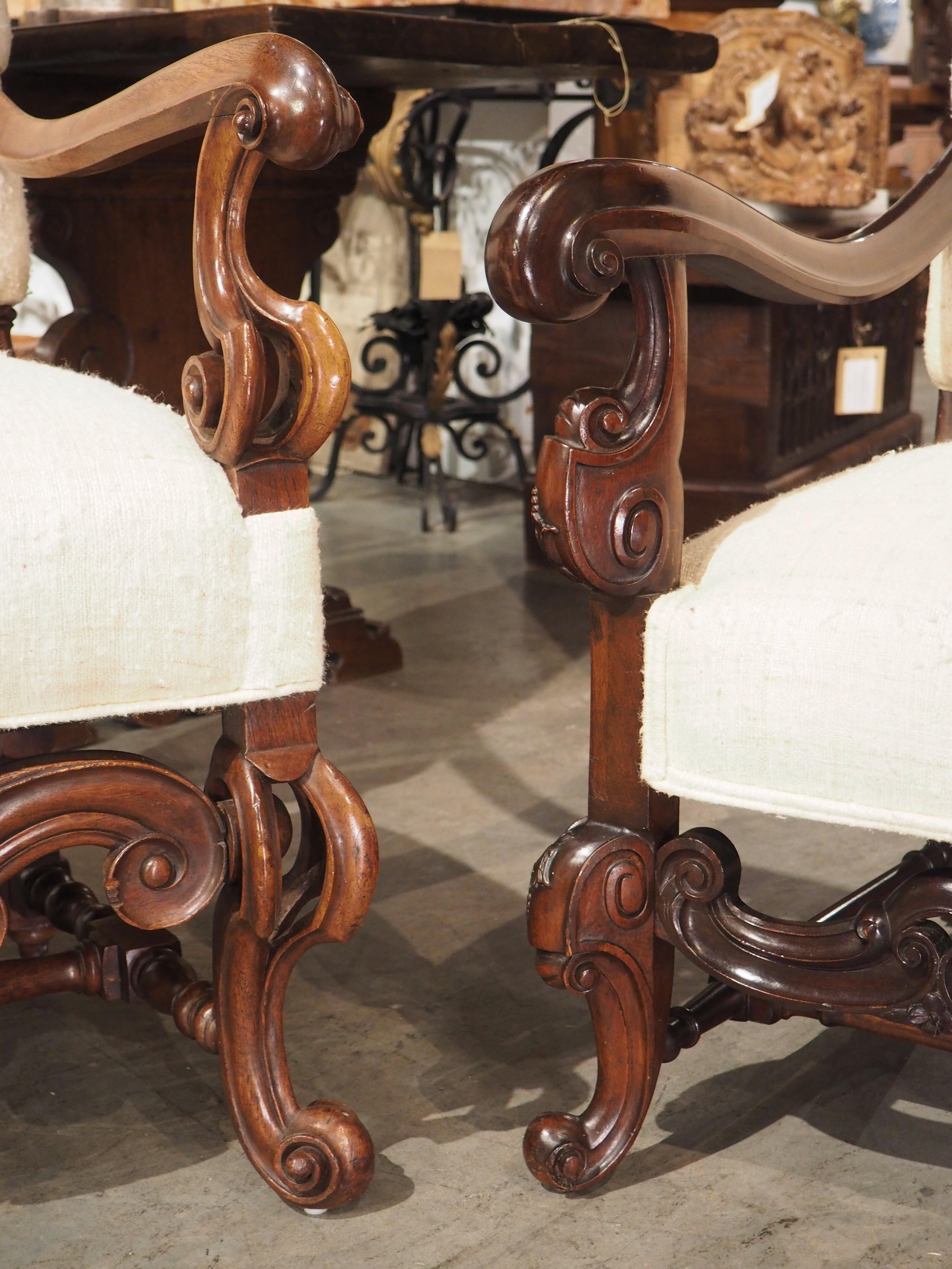 20th Century Set of His and Hers Baroque Style Carved Armchairs with Raw Silk Upholstery For Sale