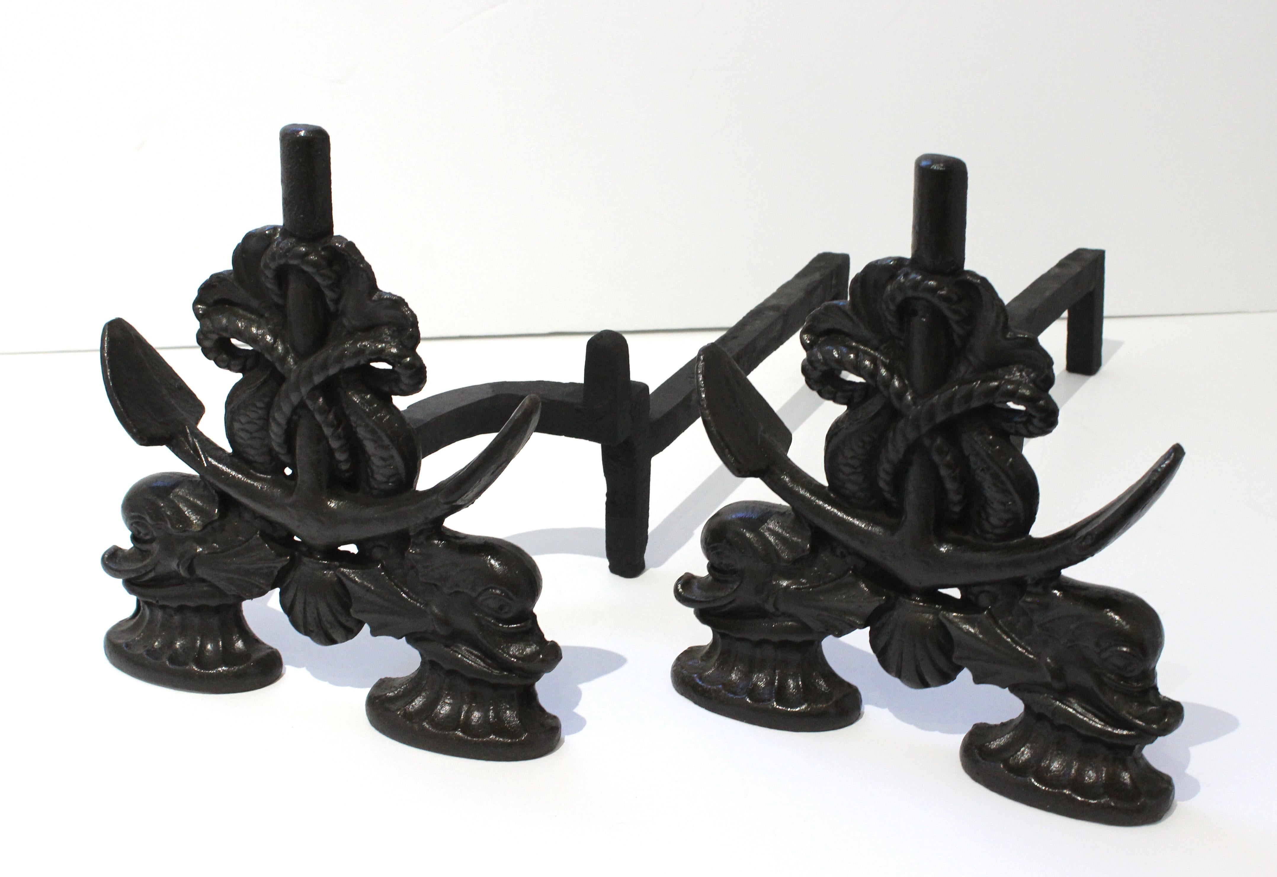 This stylish and romantic natuical themed set of andirons date to the 1920s-1930s and were created by the Howes metalworks of Boston, Massachusets. 

Note: The pieces are signed by the manufacutrer and are marked with their pattern number