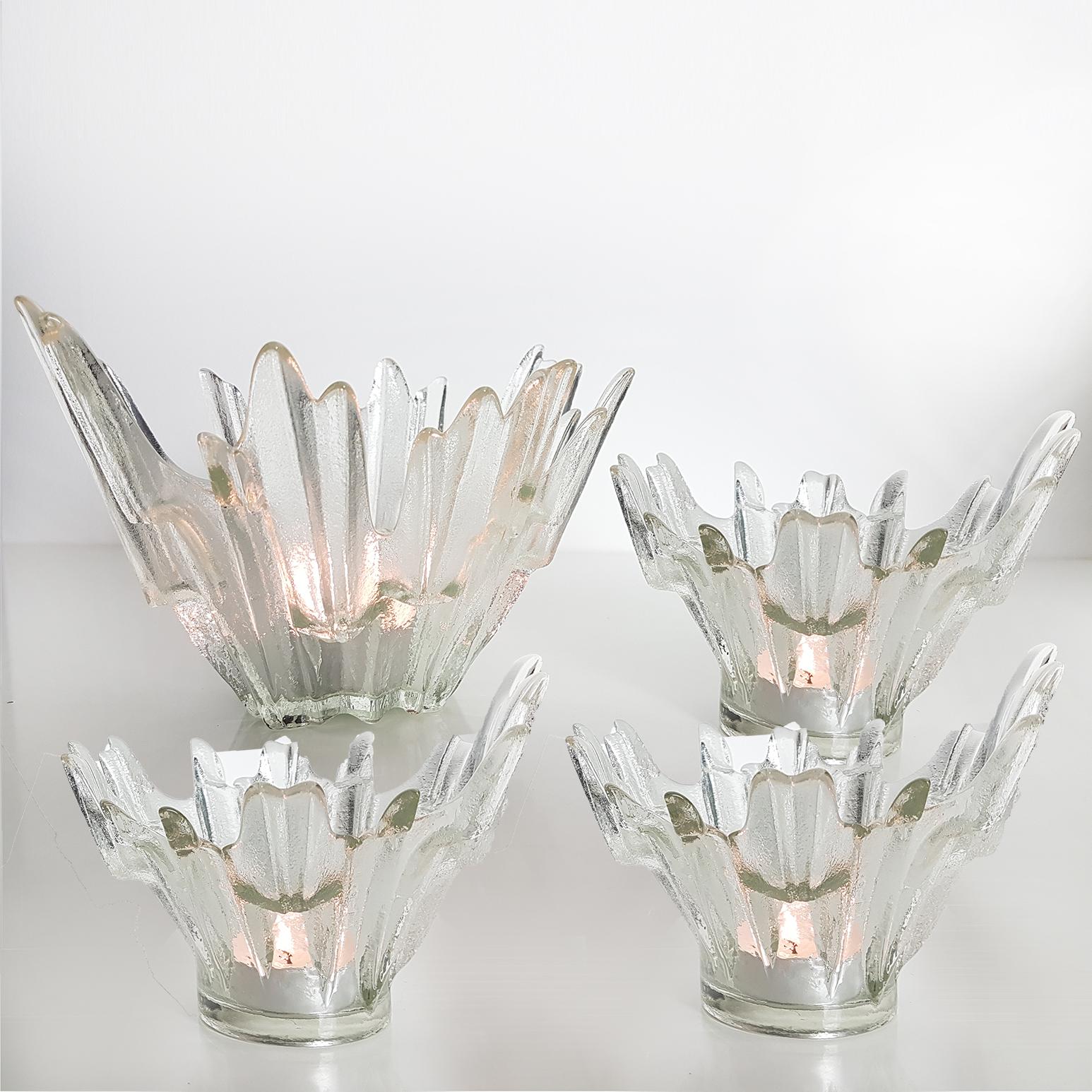 Set of (Northern Lights) bowls designed by Tauno Wirkkala for Humppila, Finland, circa 1960s. Illuminates beautifully. Thick glass in the shape of upright ice crystals. The crystals reflect the light in a very nice way. The biggest bowl is with
