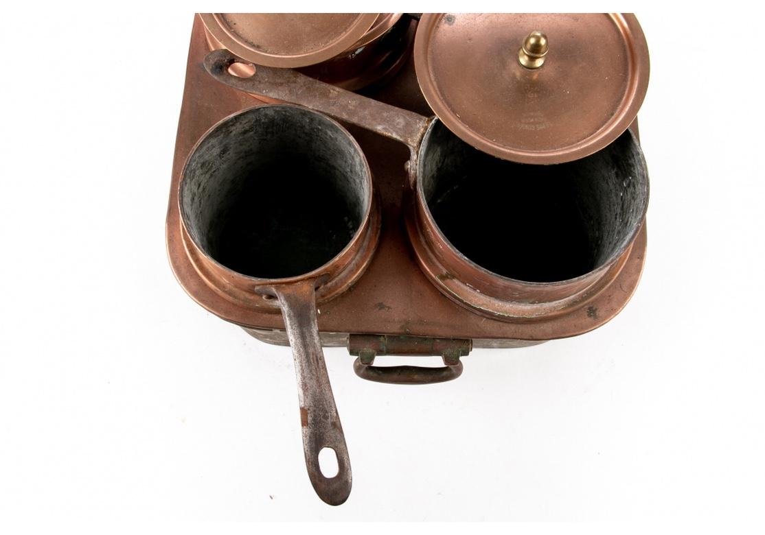 Brass Set of Industrial Era Lewis Conger 'New York/France' Copper Pots in Boiler