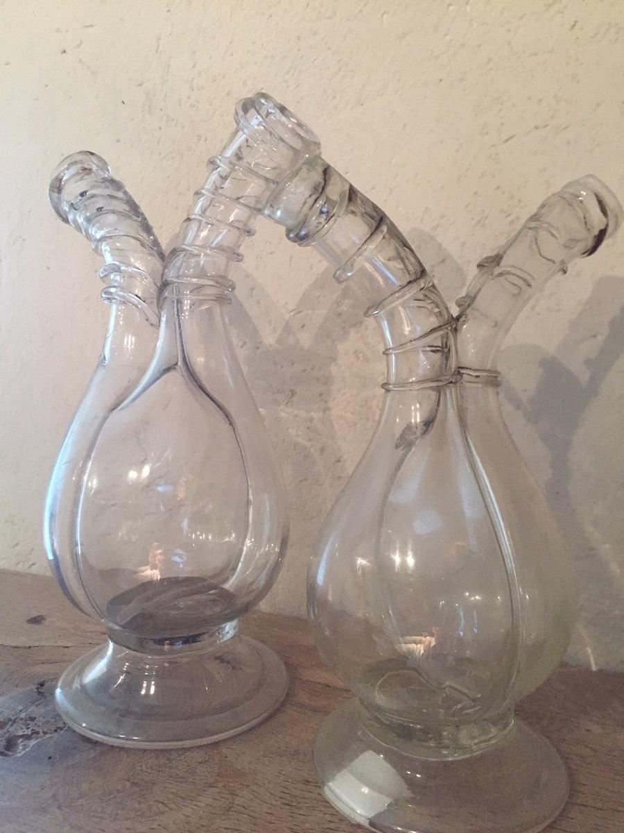 A set of handblown early 18th century Oil and Vinegar Flacons. Following the French Court etiquette rules and a taste for luxury spreaded around Europe in the 18th century. Eating became not only a feast but also a ritual and display of wealth for