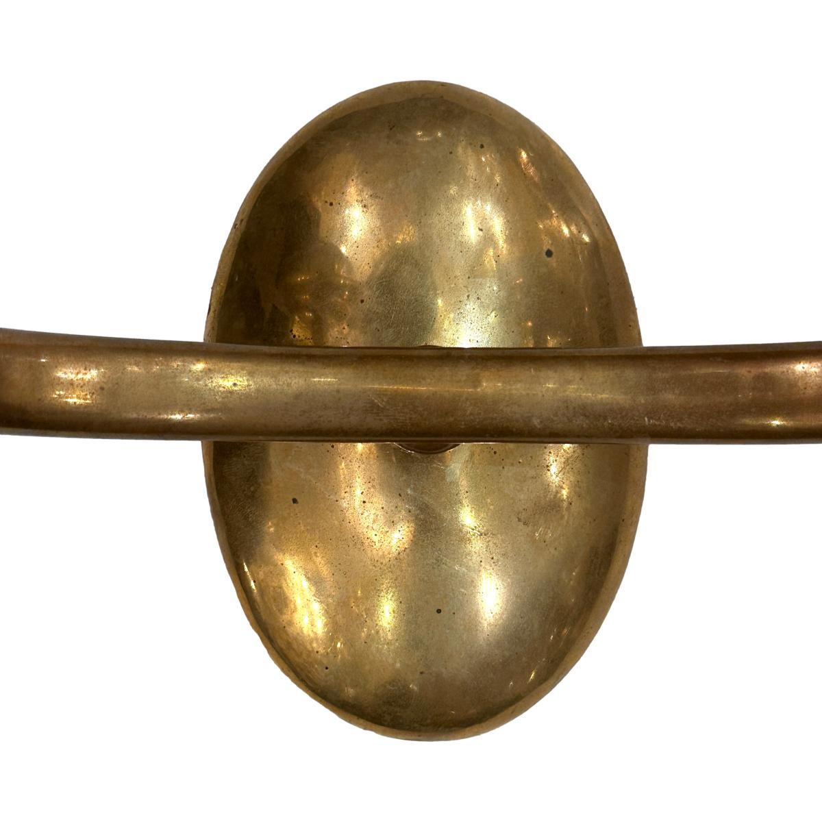 A set of six circa 1950's Italian polished bronze two-arm sconces with gold tone. Sold per pair.

Measurements:
Height: 10