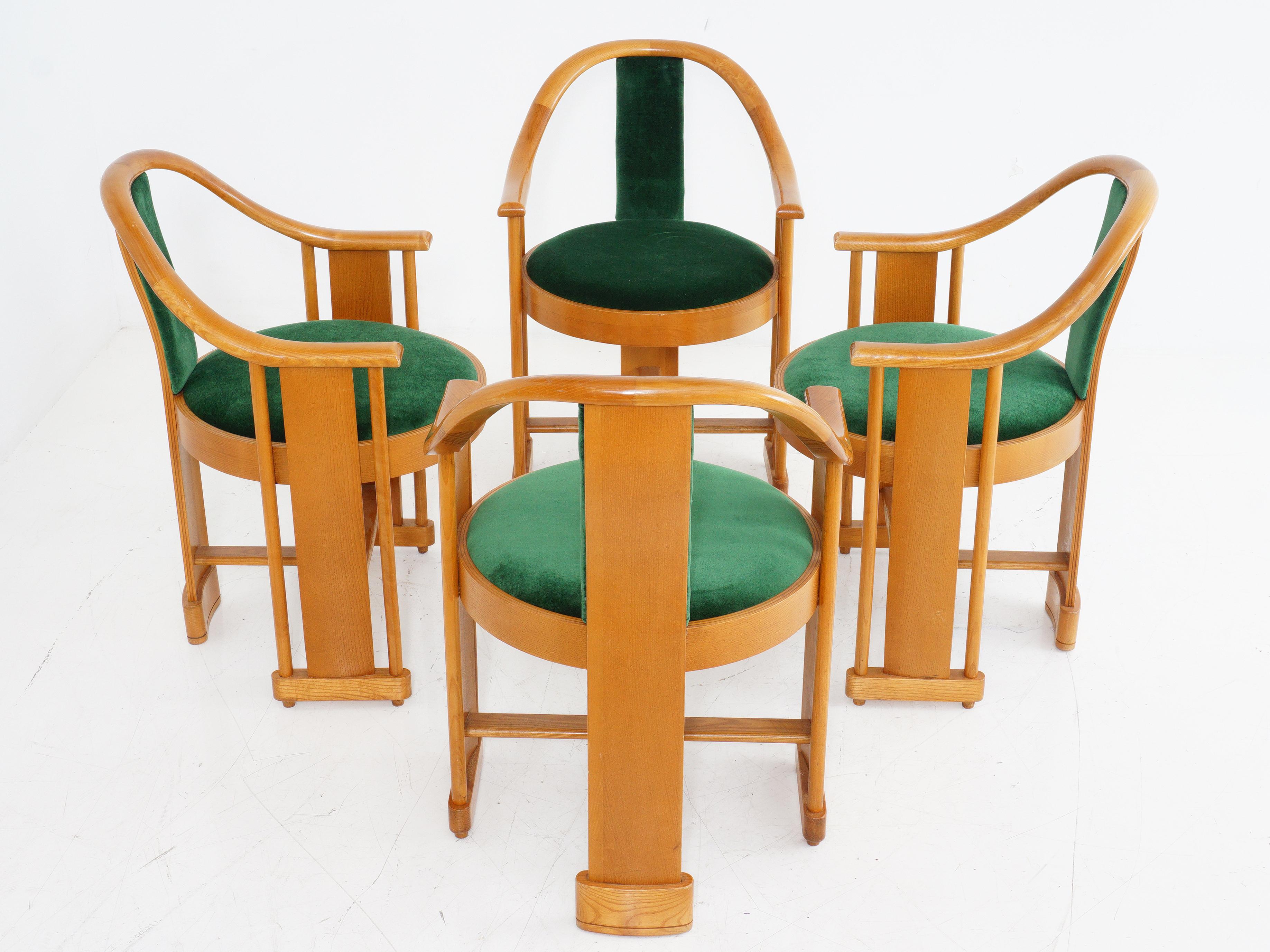 These Italian armchairs set a good example - your seating should have curves in all the right places. The aged pine rounded backs envelop you, while the emerald upholstery welcomes you with warmth and comfort. Classic craftsmanship fused with