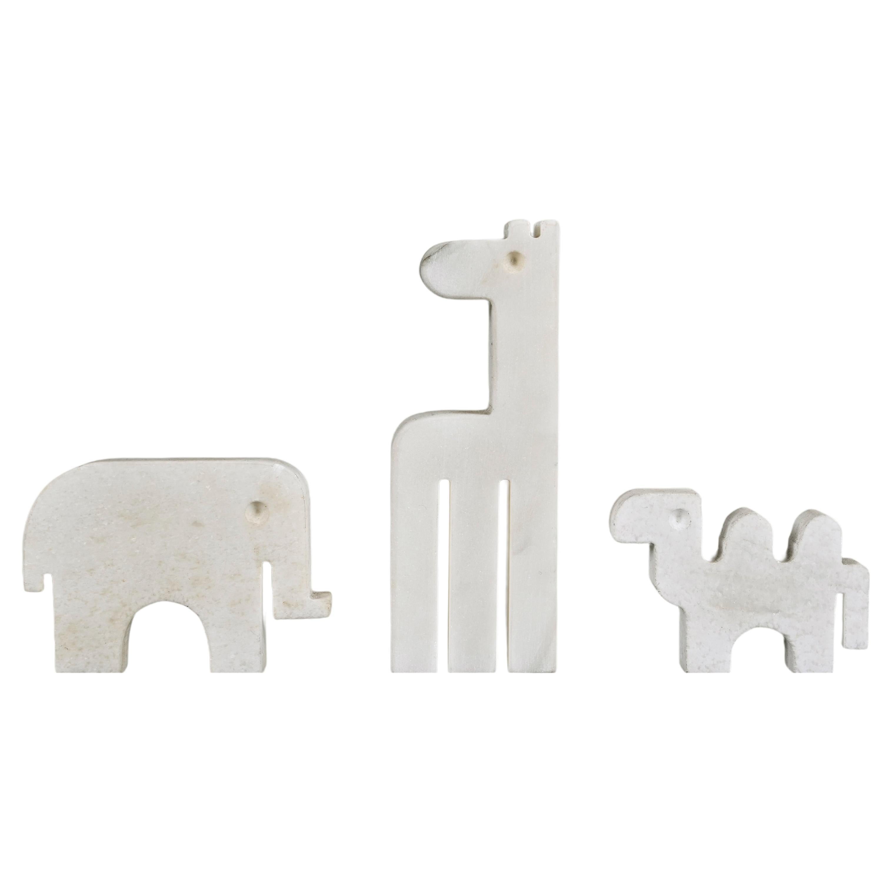 Amazing and rare set of three Carrara white marble sculptures. Fratelli Mannelli designed this fantastic set in Italy during the 1970s.

There are three elements in this set: an elephant, a giraffe and a camel. This set is extremely rare because of