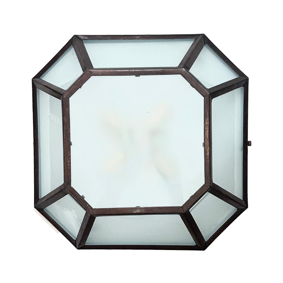 A set of 9 circa 1950's Italian patinated bronze light fixtures with frosted glass insets. Sold individually.

Measurements:
Drop : 5