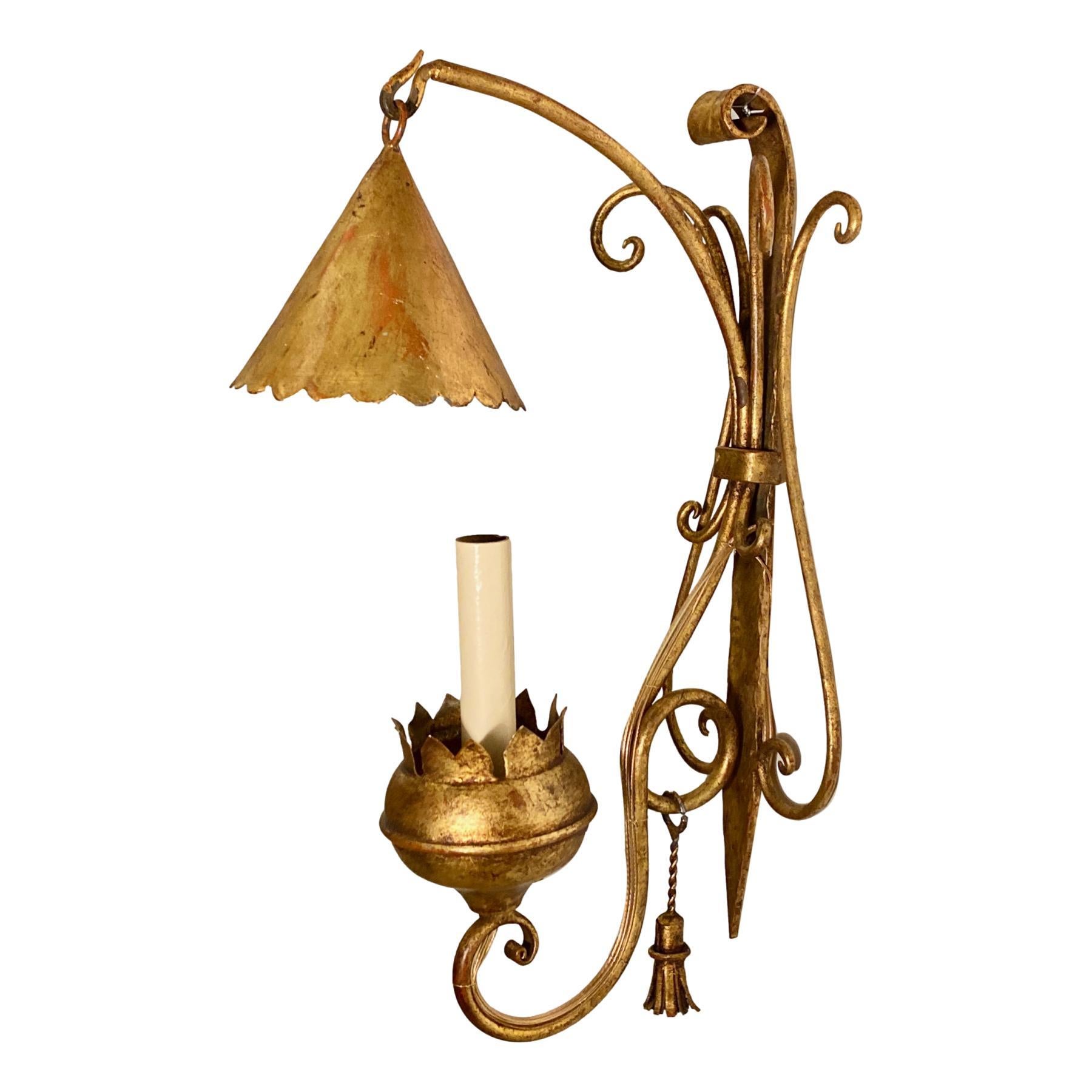 A set of six circa 1940's single light Italian gilt metal sconces with smoke bells and tassels. Sold in pairs.

Measurements:
Height: 16