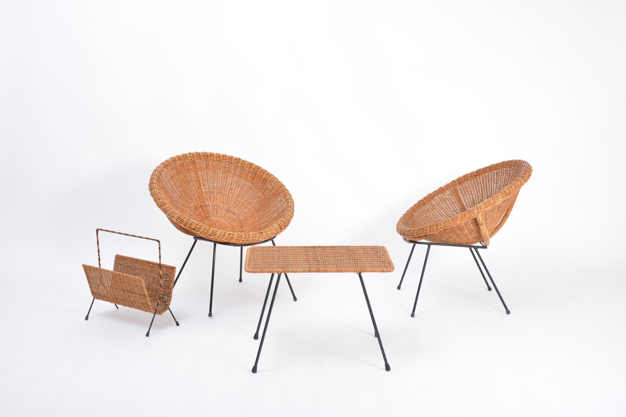 Set of Italian midcentury Rattan bowl chairs with side table and magazine rack
Beautiful set of Italian mid-century rattan furniture consisting of two bowl chairs, a side table and a magazine rack. 
Measurements of the chairs: 74 cm width x 64 cm