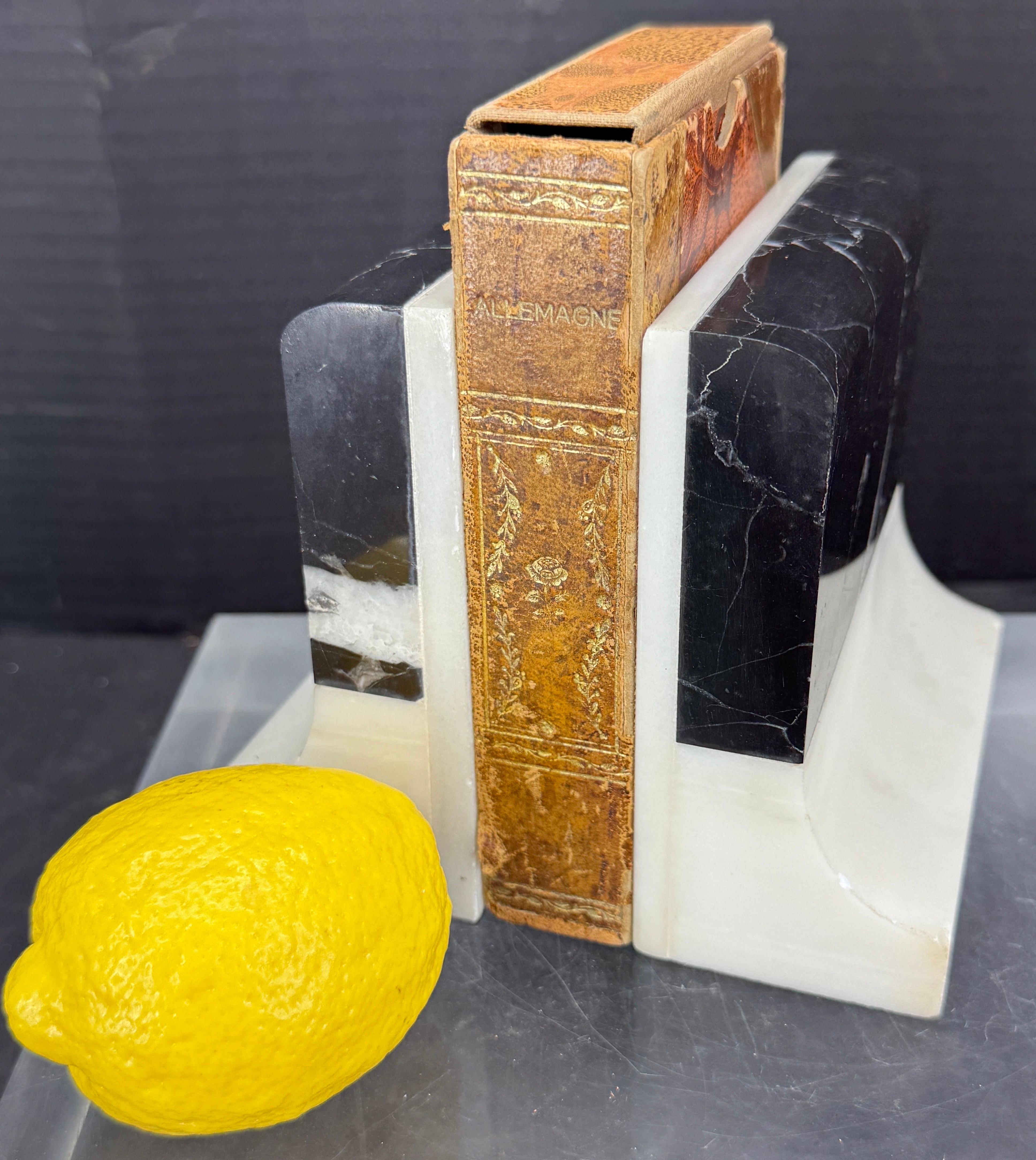 Set of white and black marble bookends, Italy circa 1960's. Wonderful addition to any home office seeking a classic or modern vibe.

