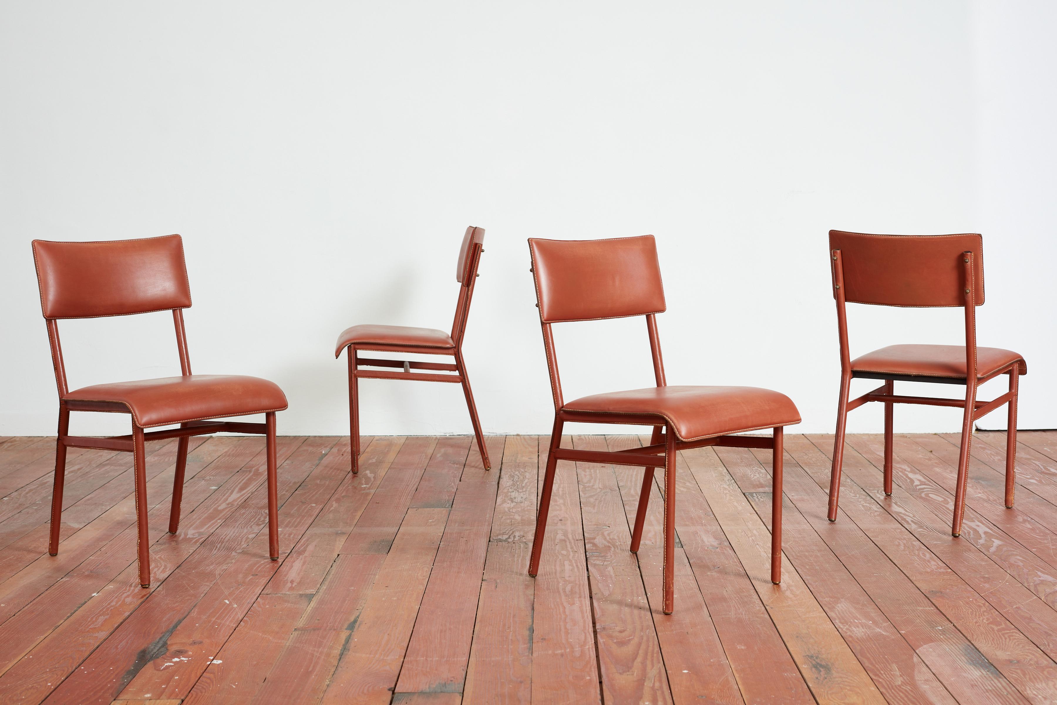 Rare set of 4x Jacques Adnet Dining Room Chairs, France 1940s
Leather is original on legs and newly upholstered seats and backs to match patina. 
Brass accents with signature contrast stitching. 
