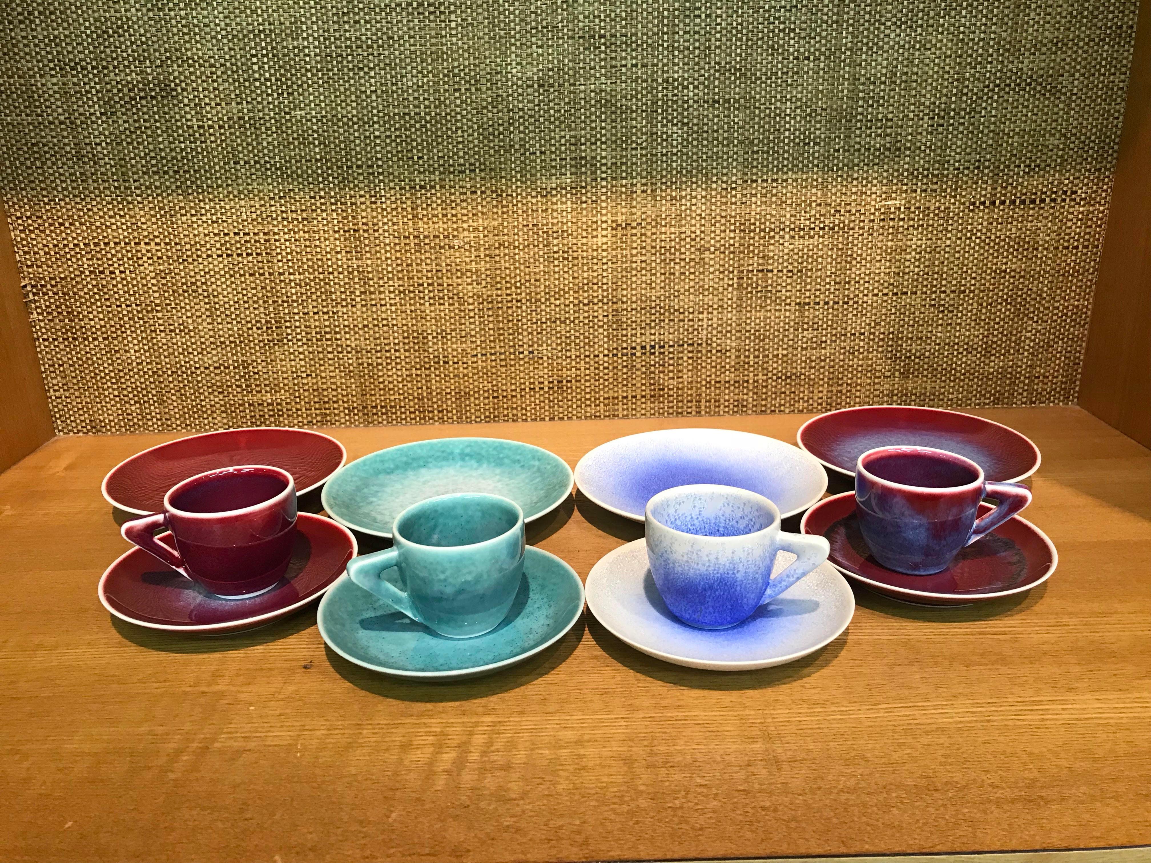 Stunning set of four contemporary Japanese signed hand-glazed porcelain demitasse cups and saucers and four matching dessert plates, in a beautiful shape masterfully hand-glazed in the artist's stunning signature colors like wine-red, green and
