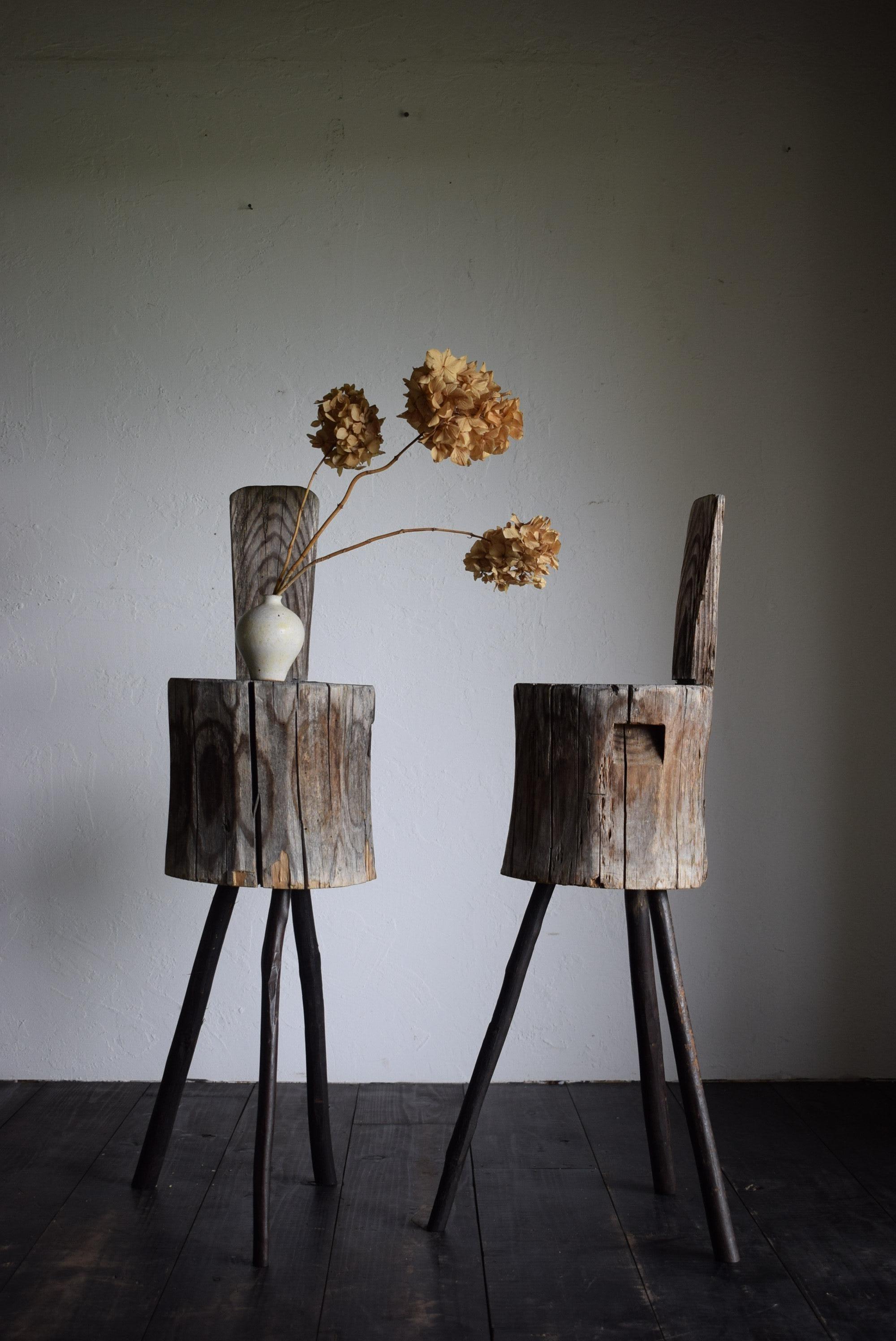 This is a small chair made from a single cedar stump, with a branch added to make a tall stool. 
It has enough space to sit on and can also be used as a side table.
The two pieces come as a set and are extremely valuable.
 The stools have a Japanese