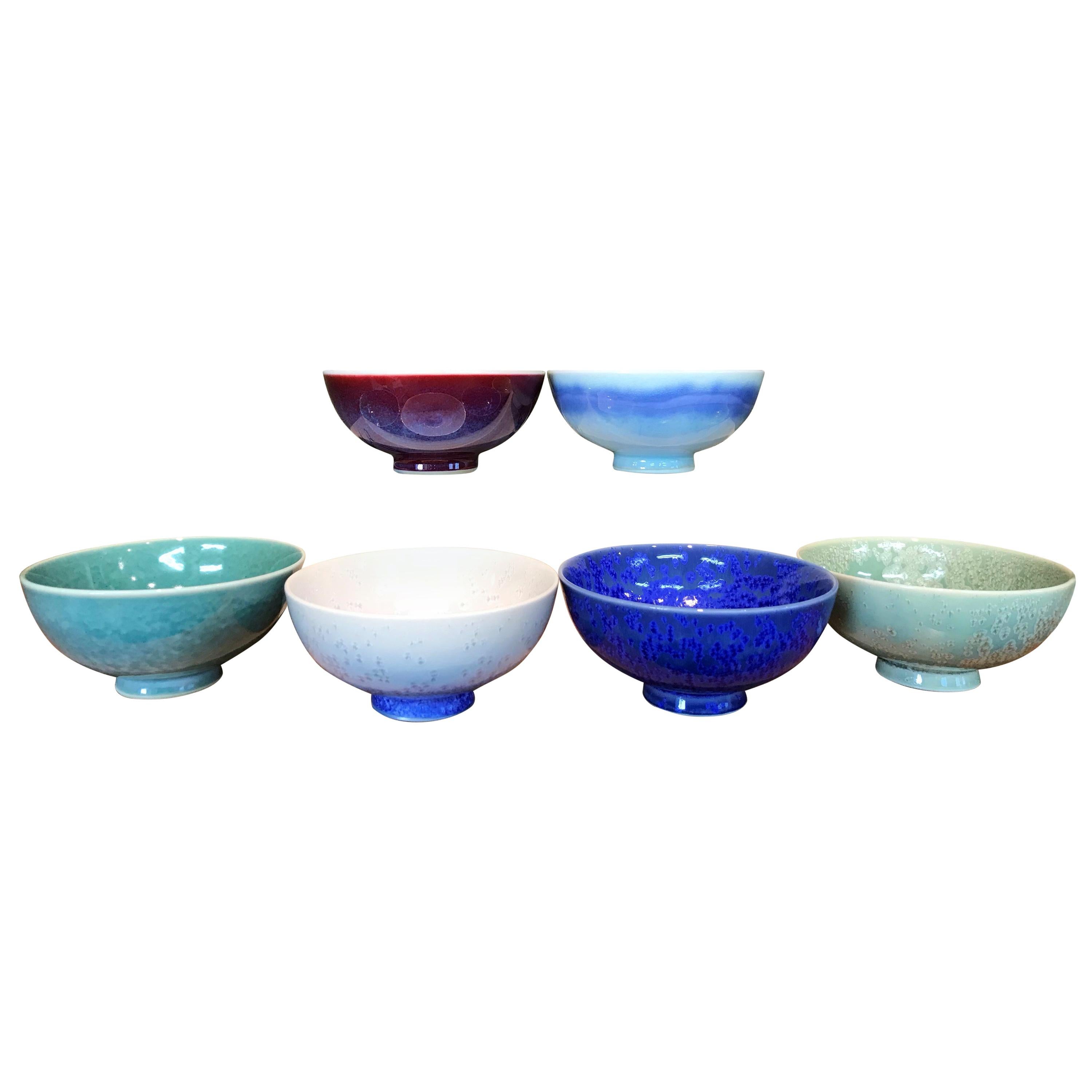 Unique set of six contemporary Japanese hand-glazed porcelain cafe latte/cappuccino cups, handsomely proportioned and masterfully glazed in the artist's signature patterns and colors, blue, wine-red, green and white, signed pieces by widely