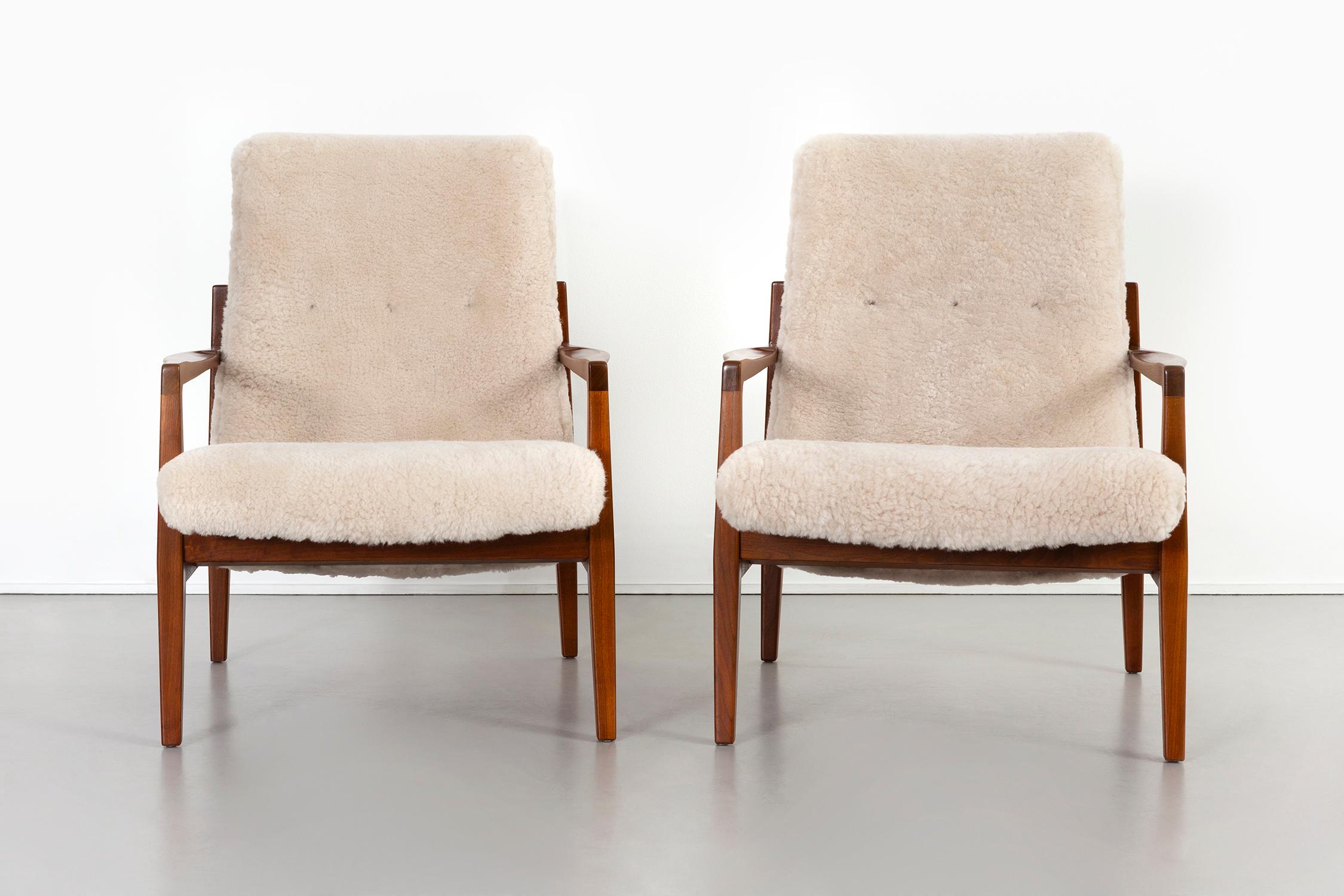 Set of lounge chairs 

Designed by Jens Risom 

USA, circa 1950s

Reupholstered in shearling and refinished walnut frames.

Measures: 35” H x 27 ¾” W x 31 ¼” D x seat 14 ½” H.
 