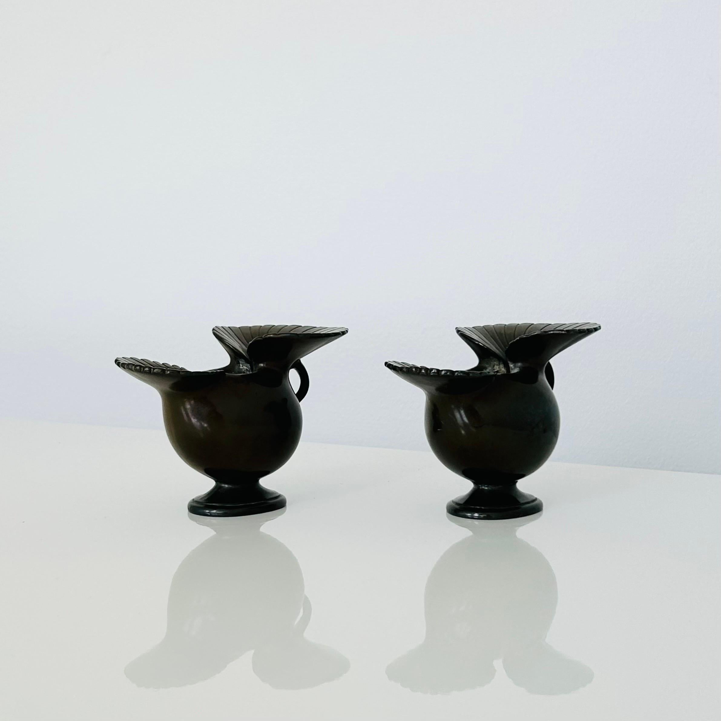 An exquisite set of metal art deco vases by Just Andersen.

This captivating pair of organic shaped metal vases, designed and crafted by the renowned artist Just Andersen the late 1920s, embody the essence of Danish mid-century design and showcase