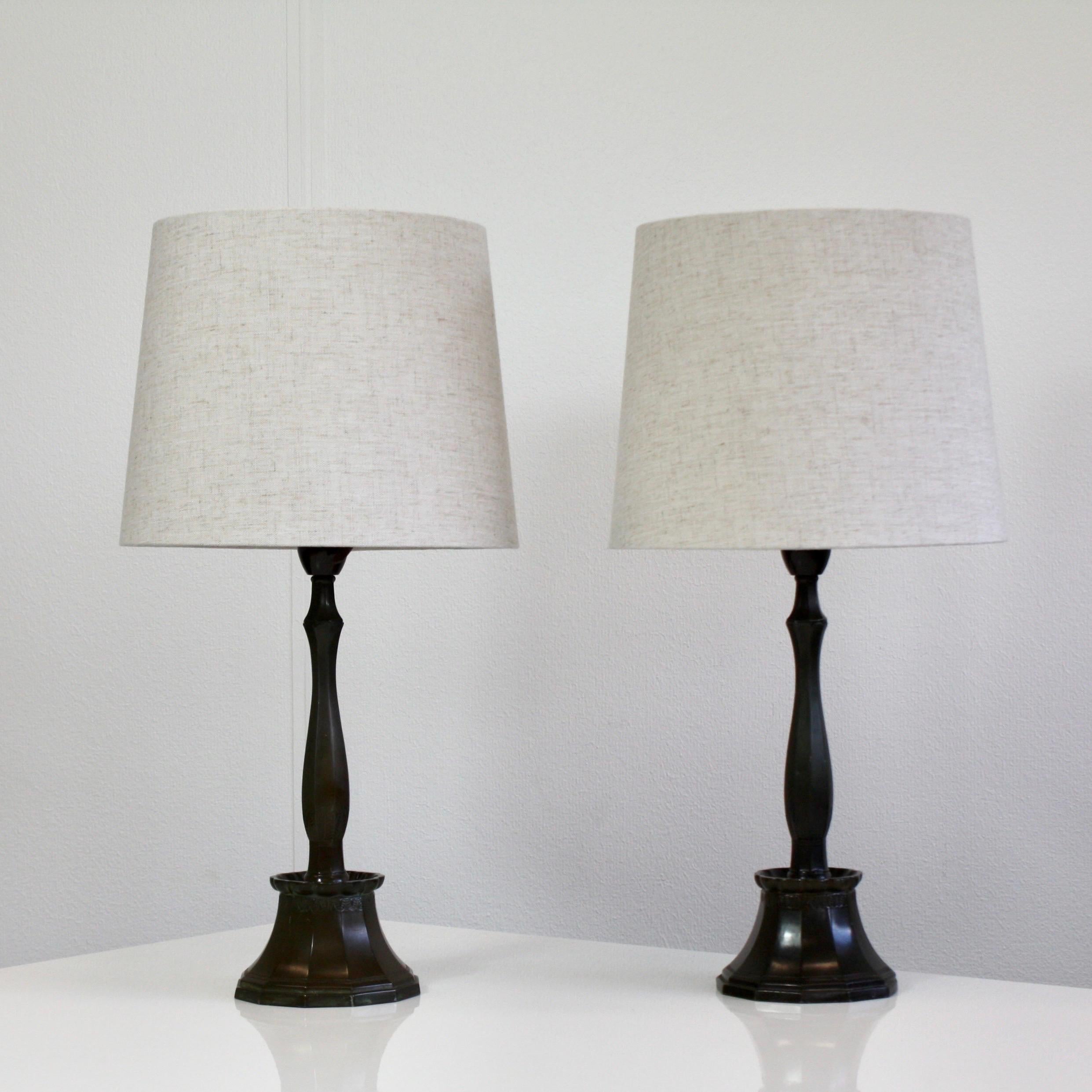 An exquisite set of Just Andersen table lamps. These lamps were created in 1926 and are part of Just Andersens early work and a true testament to his pioneerring in the Art Deco movement. 

* A pair (2) of metal lamps with 12-sided bases with