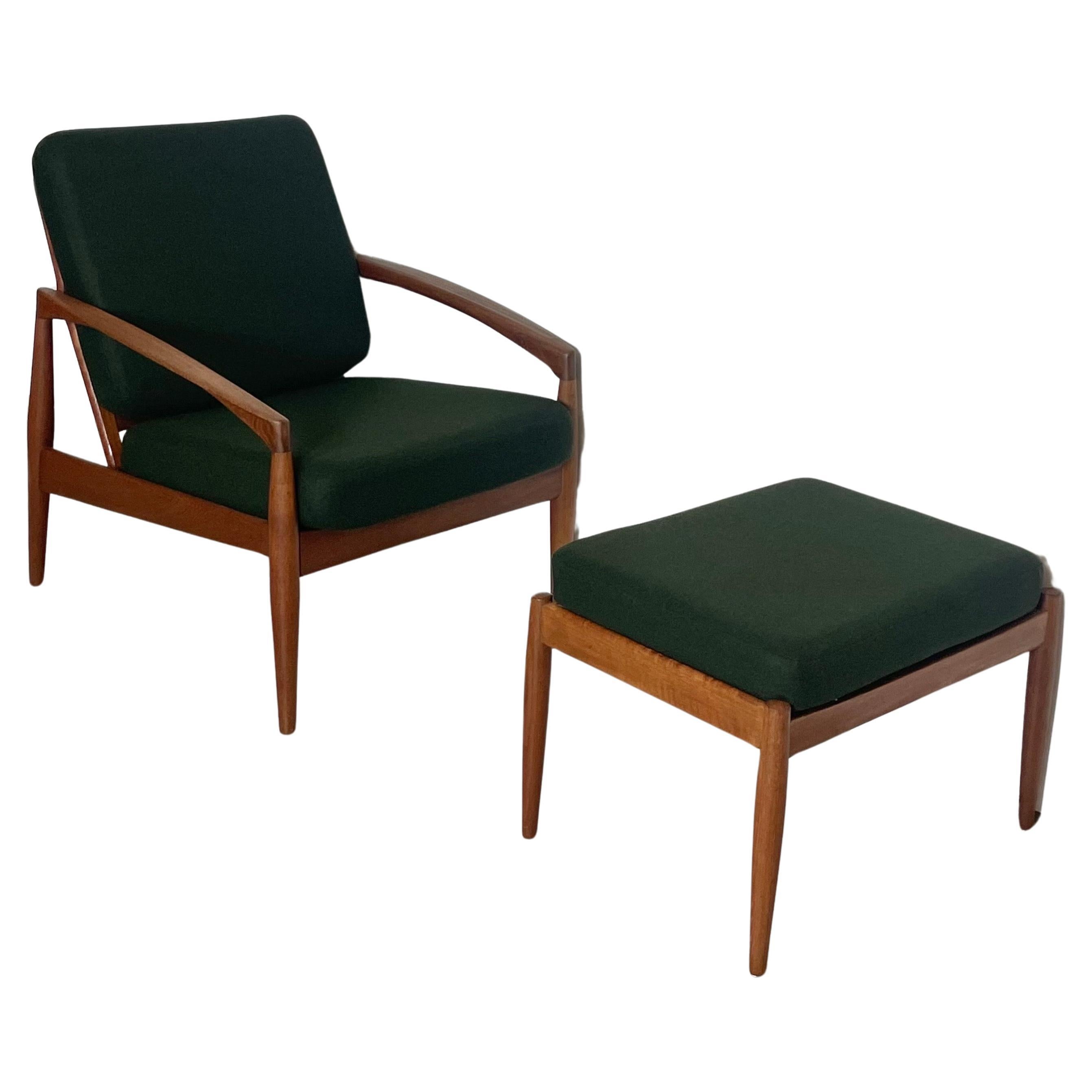 A set of Kai Kristiansen’s most celebrated design: two ‘Paper knife’ chairs crafted from solid teak wood. One of the most graceful and beautiful chairs of the Danish Modern period. The set is accoplished by a matching ottomann, also made of solid
