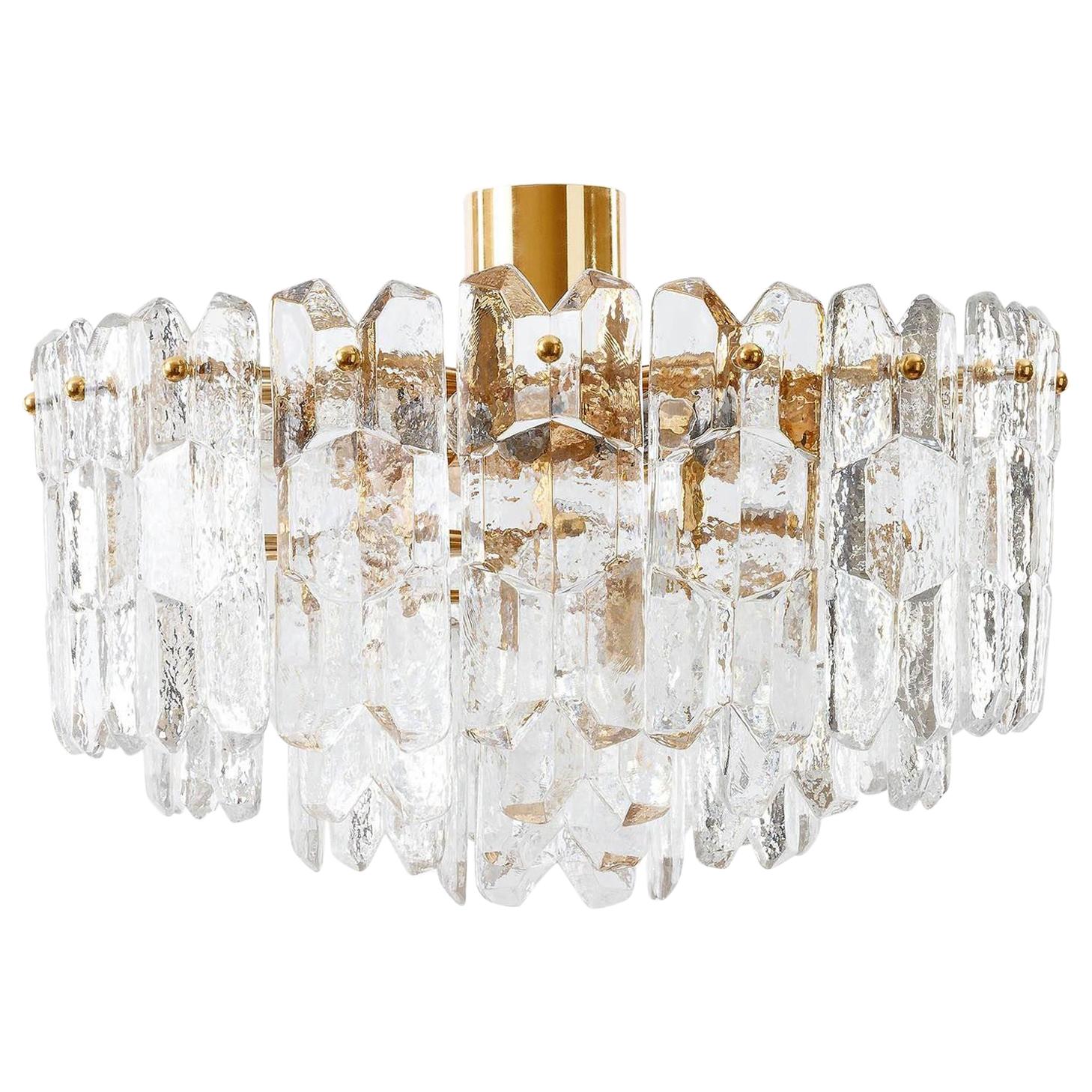 A set of very exquisite 24-carat gold-plated brass and clear brilliant glass Hollywood Regency flushmount light fixtures model 'Palazzo' by J.T. Kalmar, Vienna, Austria, manufactured in midcentury, circa 1970 (late 1960s or early 1970s).
The set