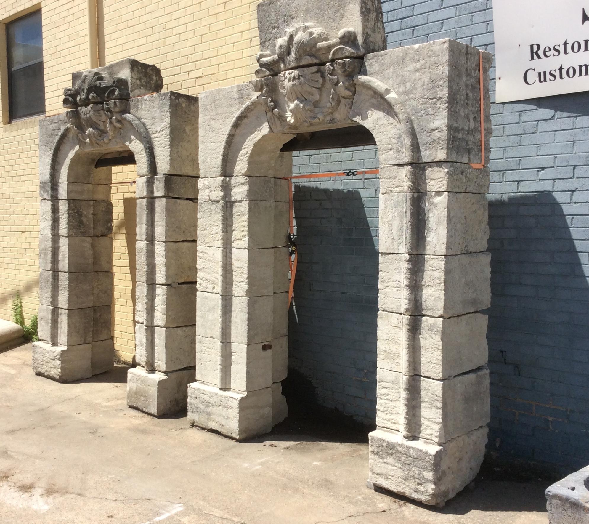 Antique limestone entryway arches, each with a decorative hand carved keystoned lintel.

Origin: France

circa 1800

Measurements: Approx. 8' W x 13' H (overall).