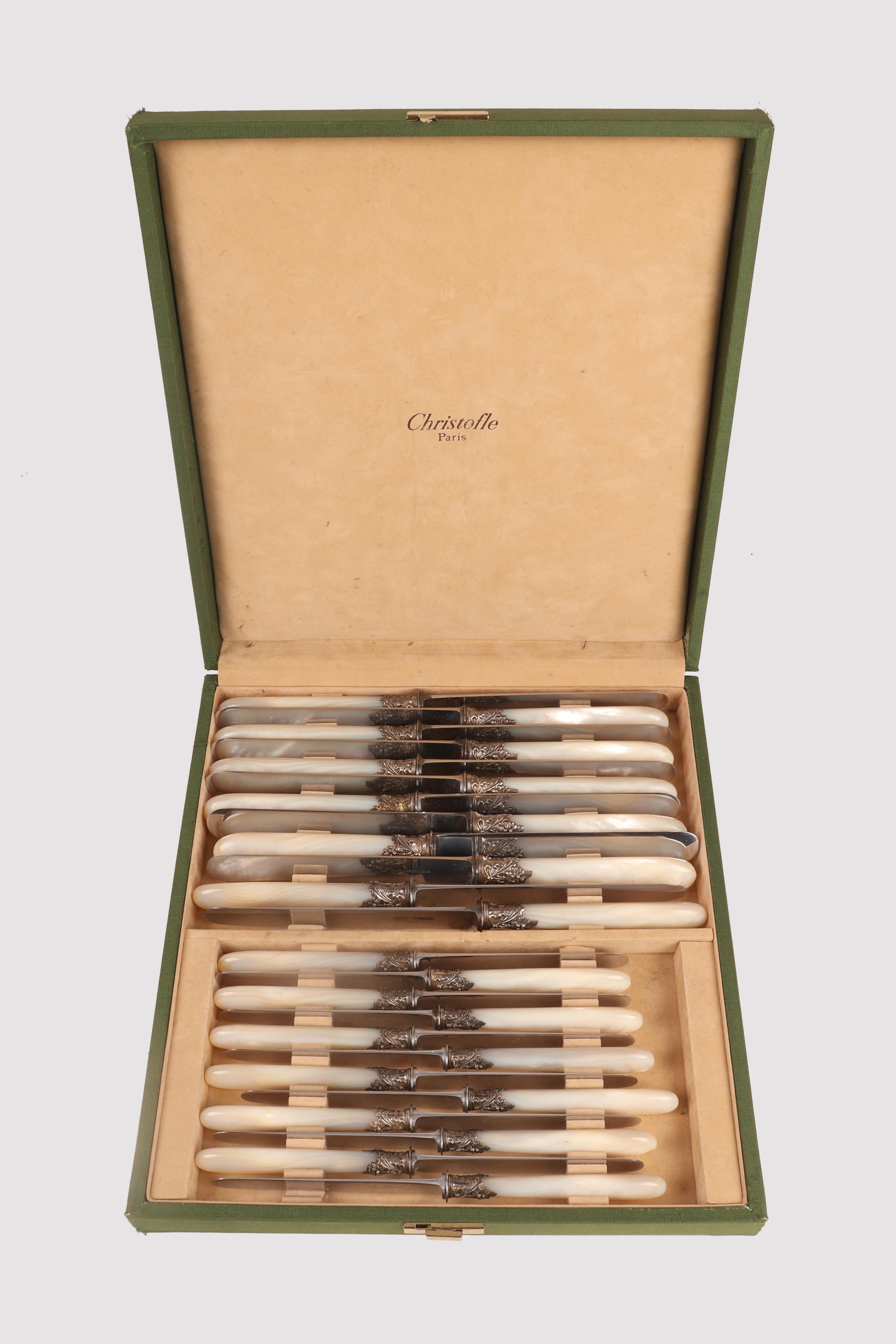 Set of knives, twelve cutting and twelve fruit knives, steel blades, marked by the silversmith Ernest Cardeilhac who joined the Maison Christofle in 1951. The handles are made of a single core of mother-of-pearl slightly expanded at the base and