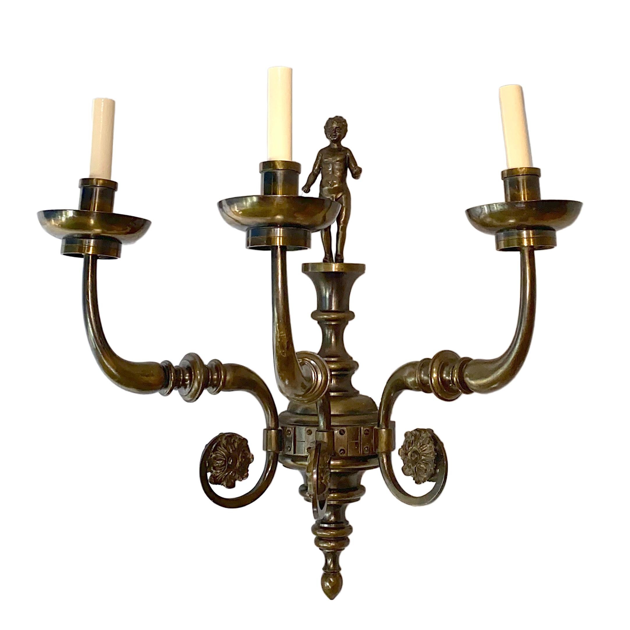 A set of four large circa 1900 Dutch three-arm patinated bronze sconces with figural putto crowning each sconce. Sold per pair.

Measurements:
Height: 23