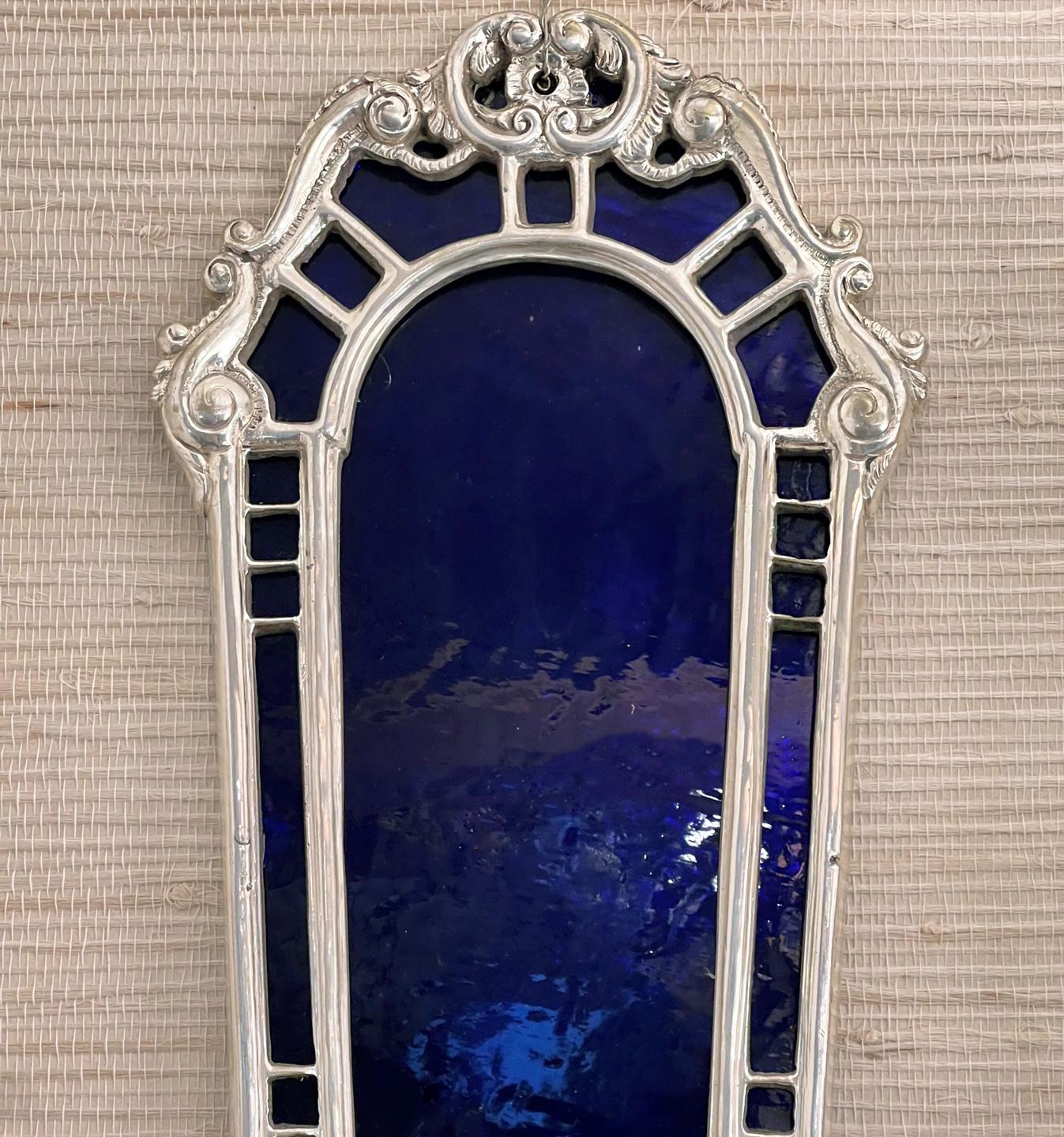 A set of ten circa 1920's American two-arm silver plated sconces with cobalt blue mirror on the frame. Sold per pair.

Measurements:
Height: 21.5