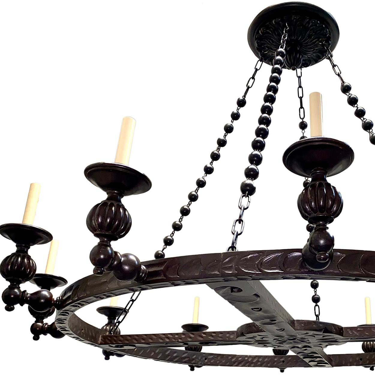 A set of five circa 1940's Spanish carved wood chandeliers with original beads and canopy. Sold individually.

Measurements:
Diameter: 60