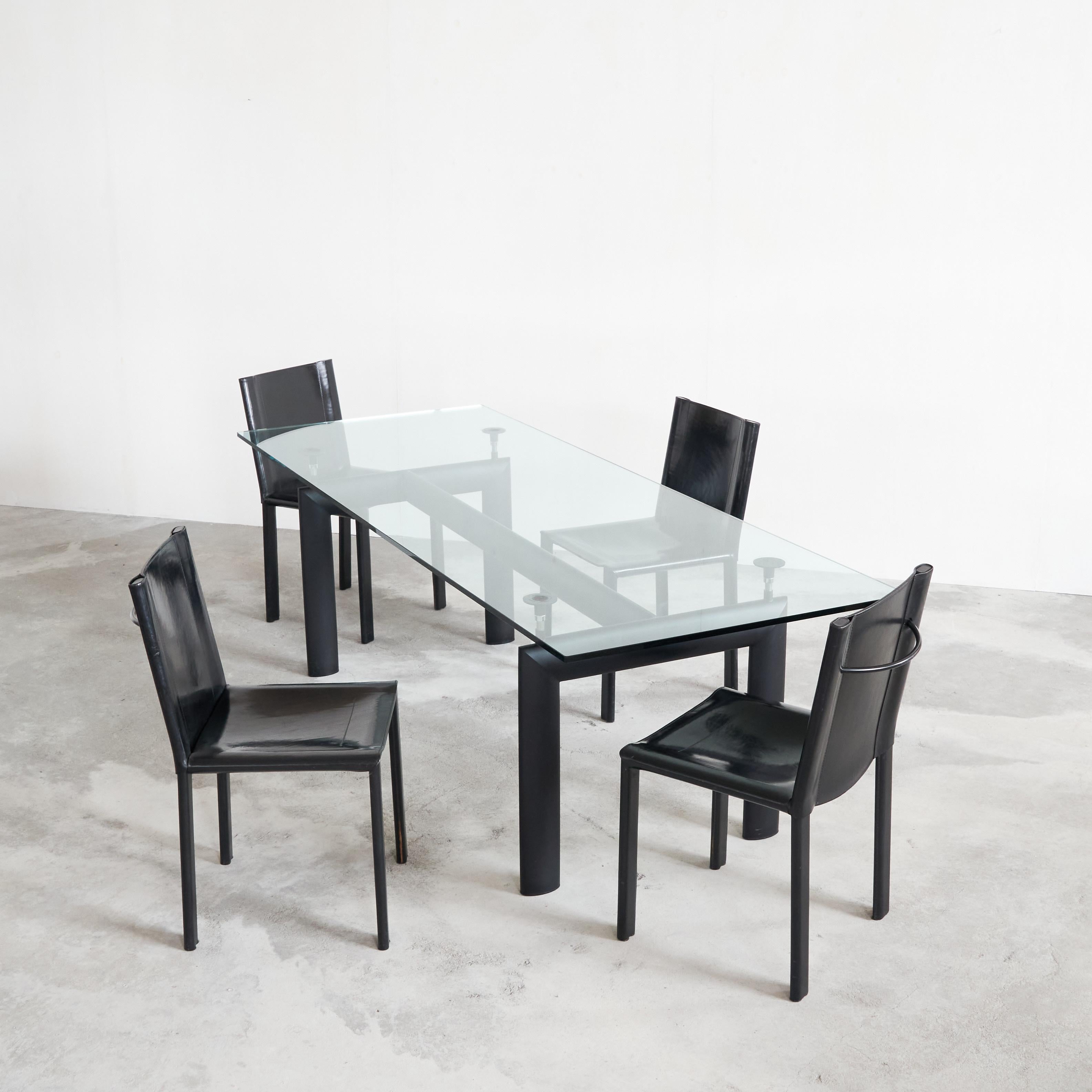 Le Corbusier, Perriand and Jeanneret LC6 'Table Tube D’avion', Cassina edition, Italy, 1990s & Set of 4 Black Leather Chairs by Matteo Grassi, Italy, 1990s.

The table:

The core concept for the Table tube d’avion table, introduced in 1929 at the