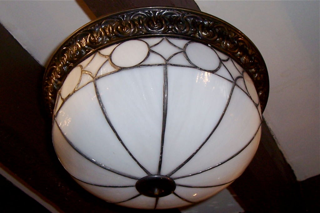 Set of eleven English circa 1930s leaded glass light fixtures. Sold Individually. 

Measurements:
Diameter 14.5
