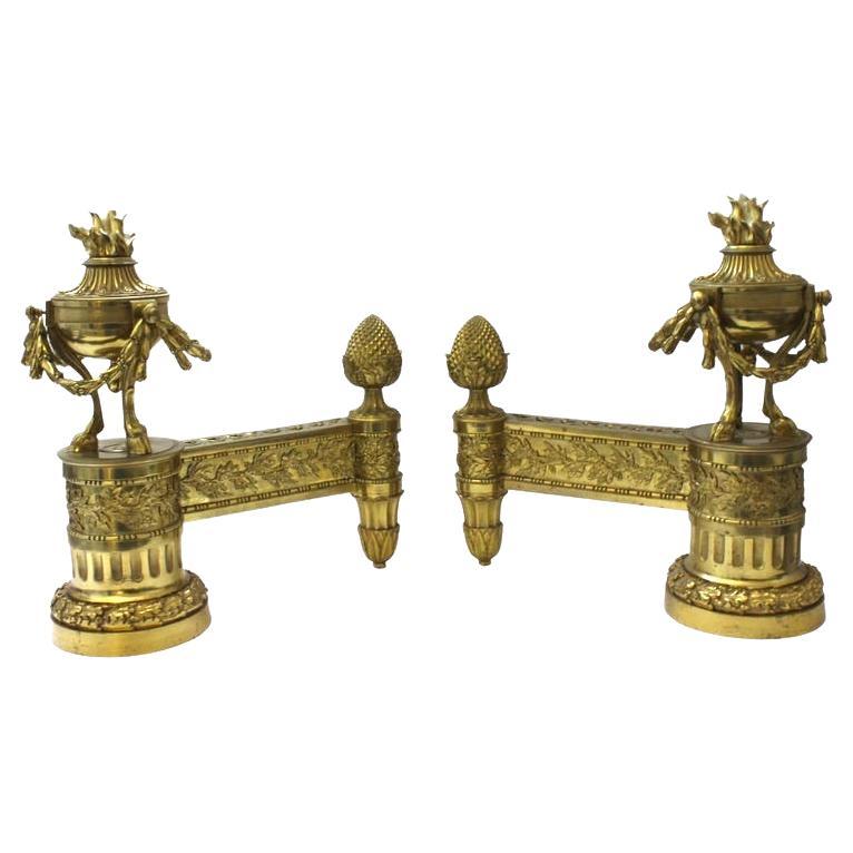 This stylish set of Louis XVI revival bronze chenets date to the latter part of the 19th century.

Note: On each Chenet one of the bronze mounting screws is a darker patinated coloration.