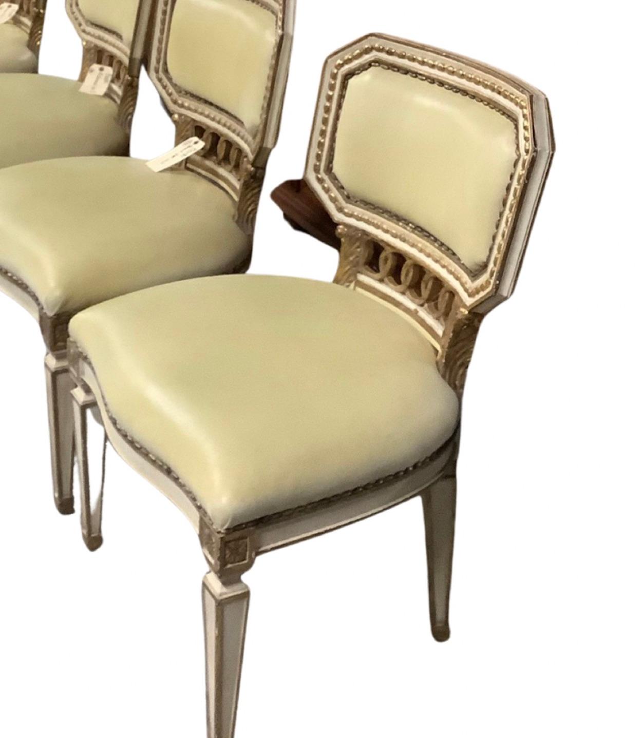 Set of Louis XVI Style Dining Chairs (12) 

Painted Dining Chairs with Gilt roping detail, pale buttery leather and nail heads/Wear consistent with age and use

36