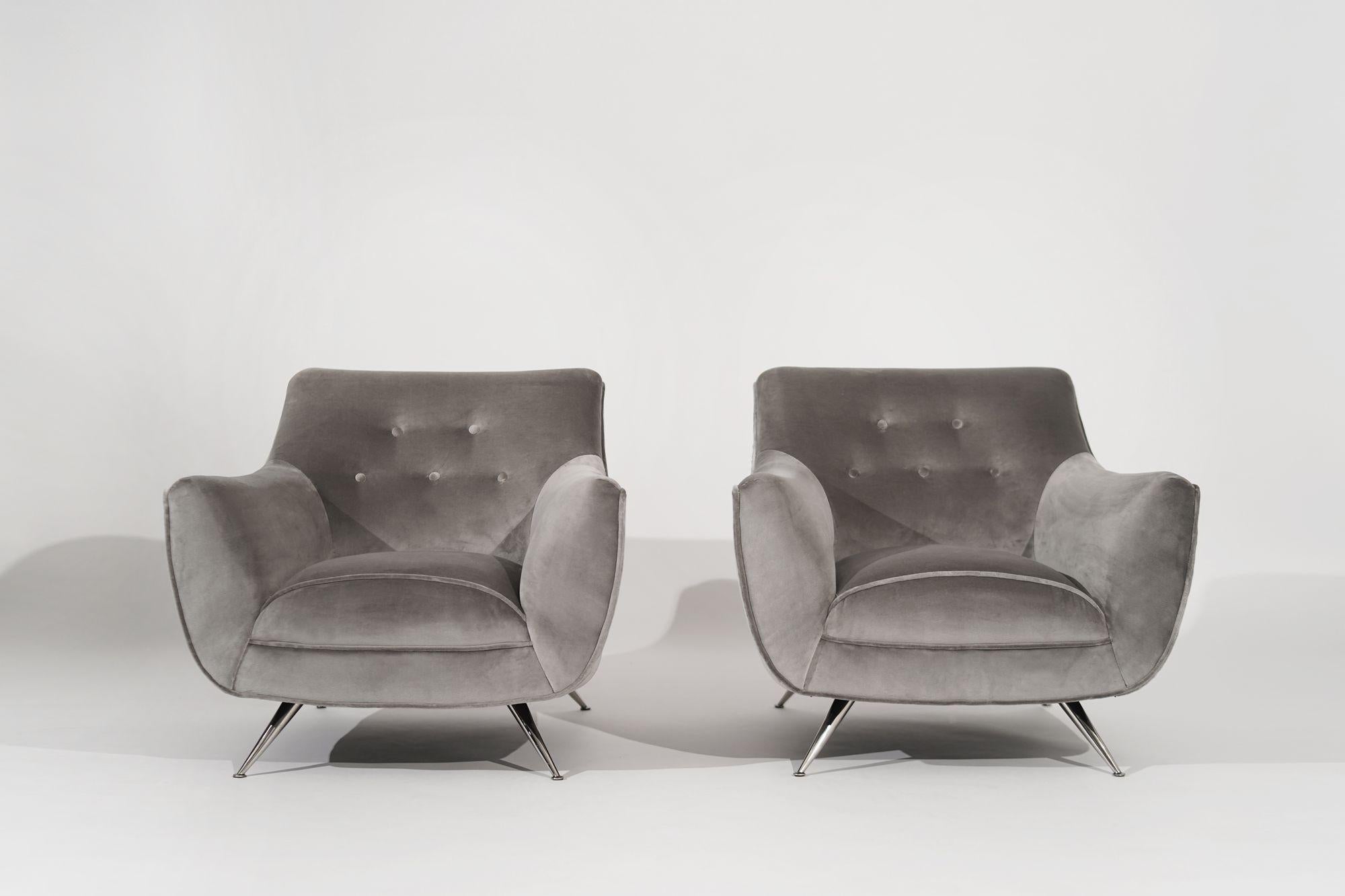 A fully restored pair of iconic lounge chairs designed by Henry Glass in the 1950s. Meticulously brought back to their original beauty, these chairs feature a luxurious grey alpaca velvet upholstery for enhanced elegance and comfort. The nickel