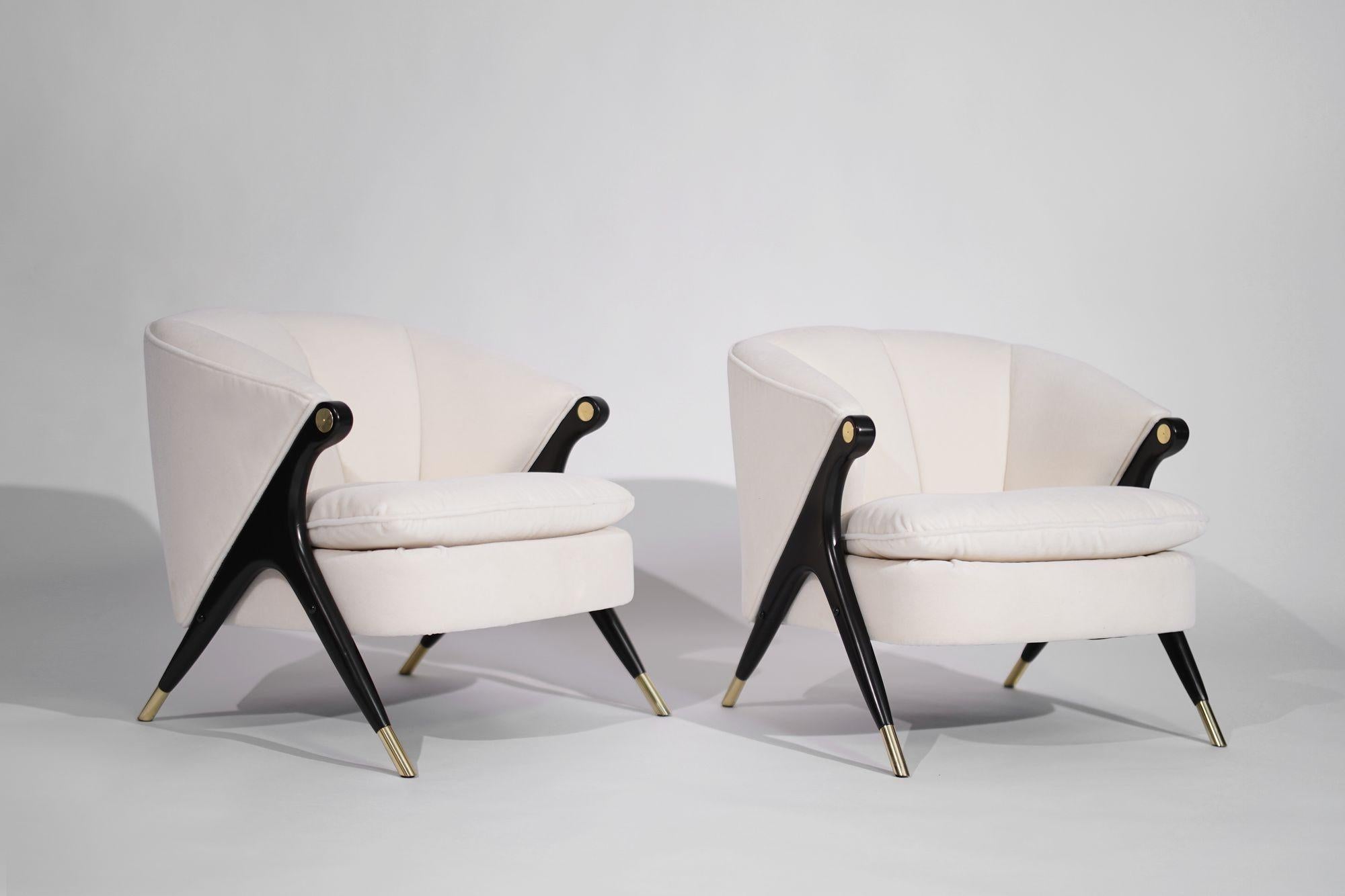 Elevate your space with these stunning lounge chairs by The Karpen of California Company, crafted circa 1950-1959. Restored to perfection, the maple legs are newly ebonized, matching the original finish. Upholstered in off-white mohair by Holl Hunt,