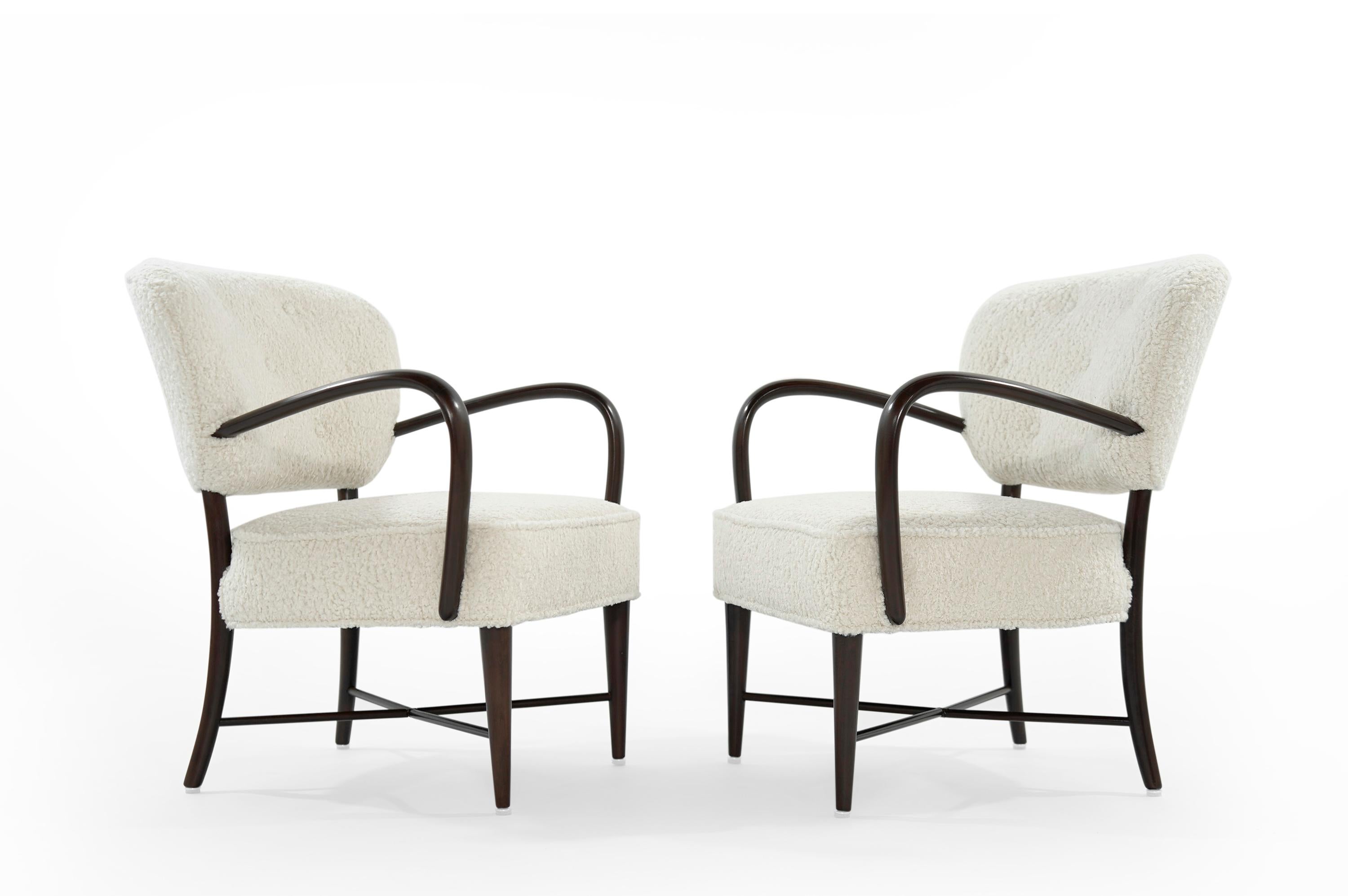A handsome set of Italian open arm lounge chairs newly upholstered in bouclé by Kravet. Walnut frame fully restored.