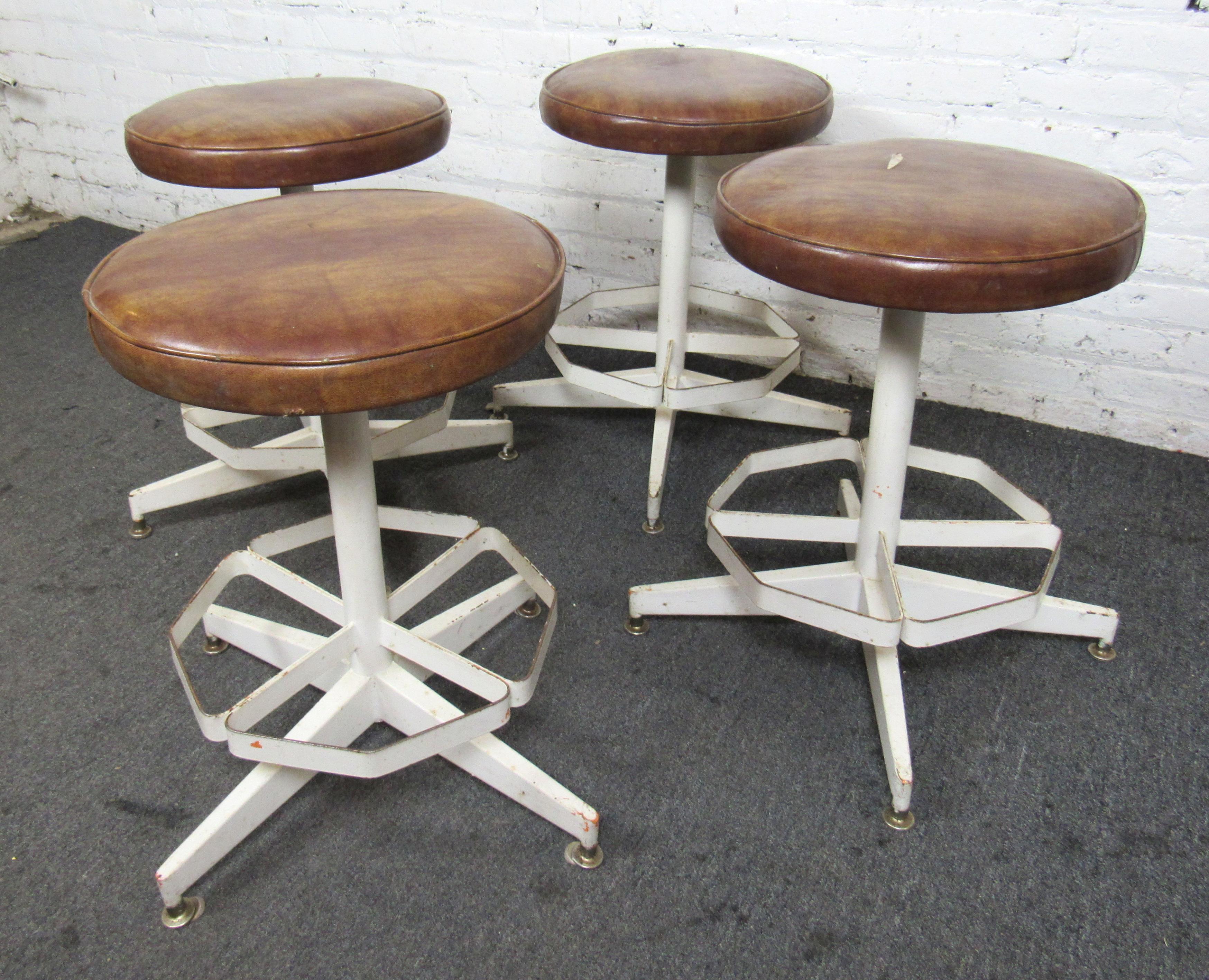 Vintage iron factory stools with vinyl cushions. Painted metal frames with footrests. 
(Please confirm location NY or NJ)